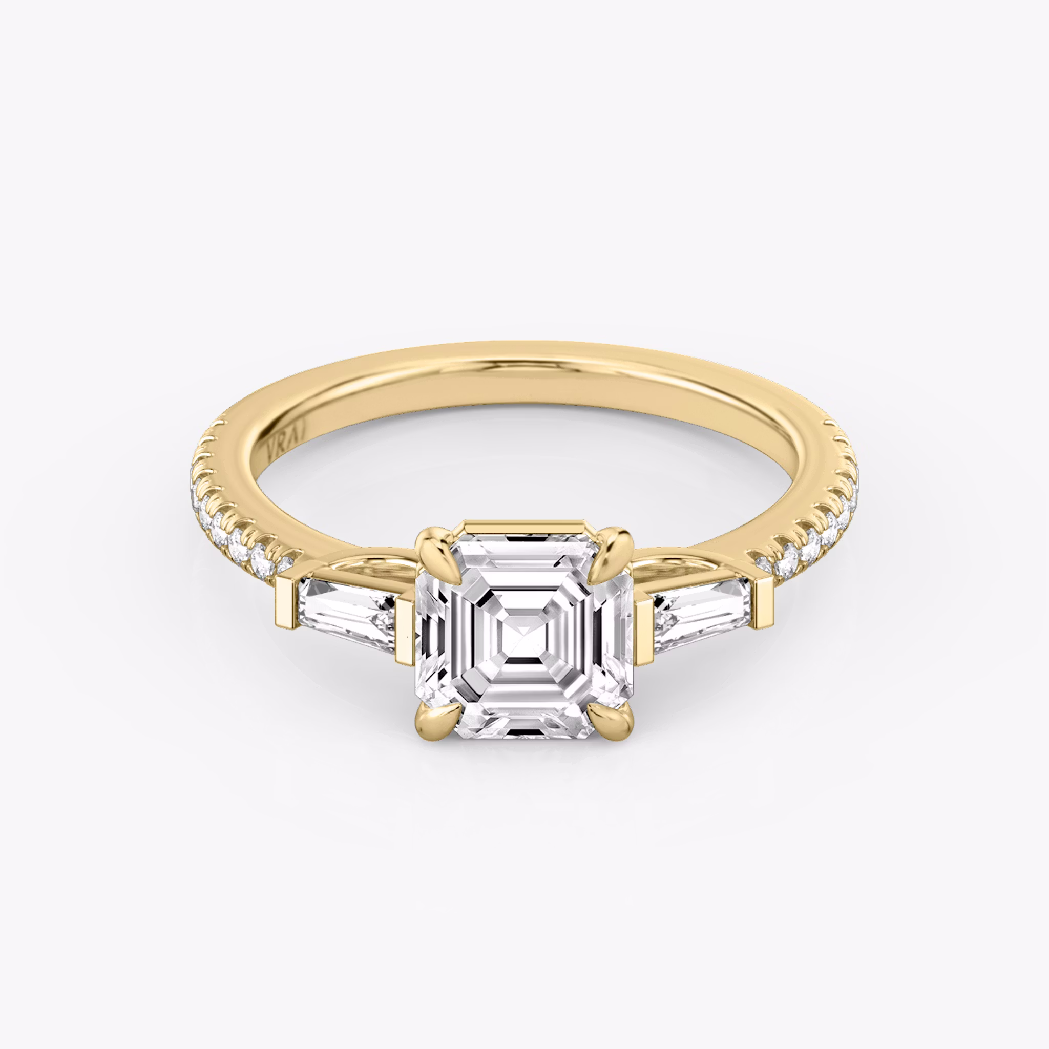 The Three Stone | Asscher | 18k | Yellow Gold | bandAccent: Pavé | sideStoneCarat: 0.10ct | sideStoneShape: Tapered Baguette | diamondOrientation: vertical | caratWeight: other