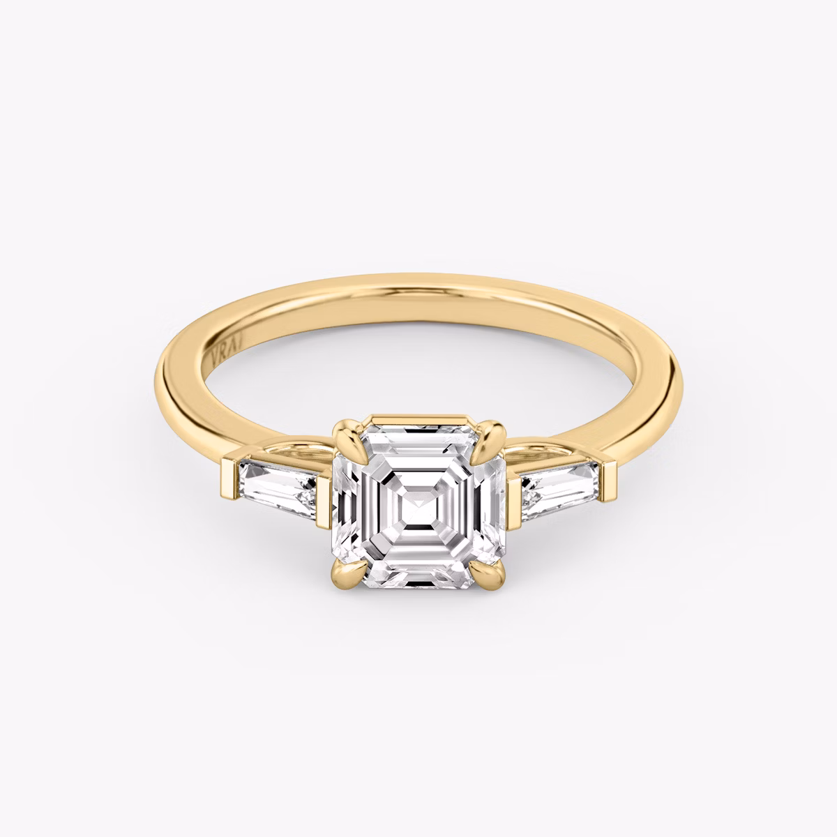 The Three Stone | Asscher | 18k | Yellow Gold | bandAccent: Plain | sideStoneCarat: 0.10ct | sideStoneShape: Tapered Baguette | diamondOrientation: vertical | caratWeight: other