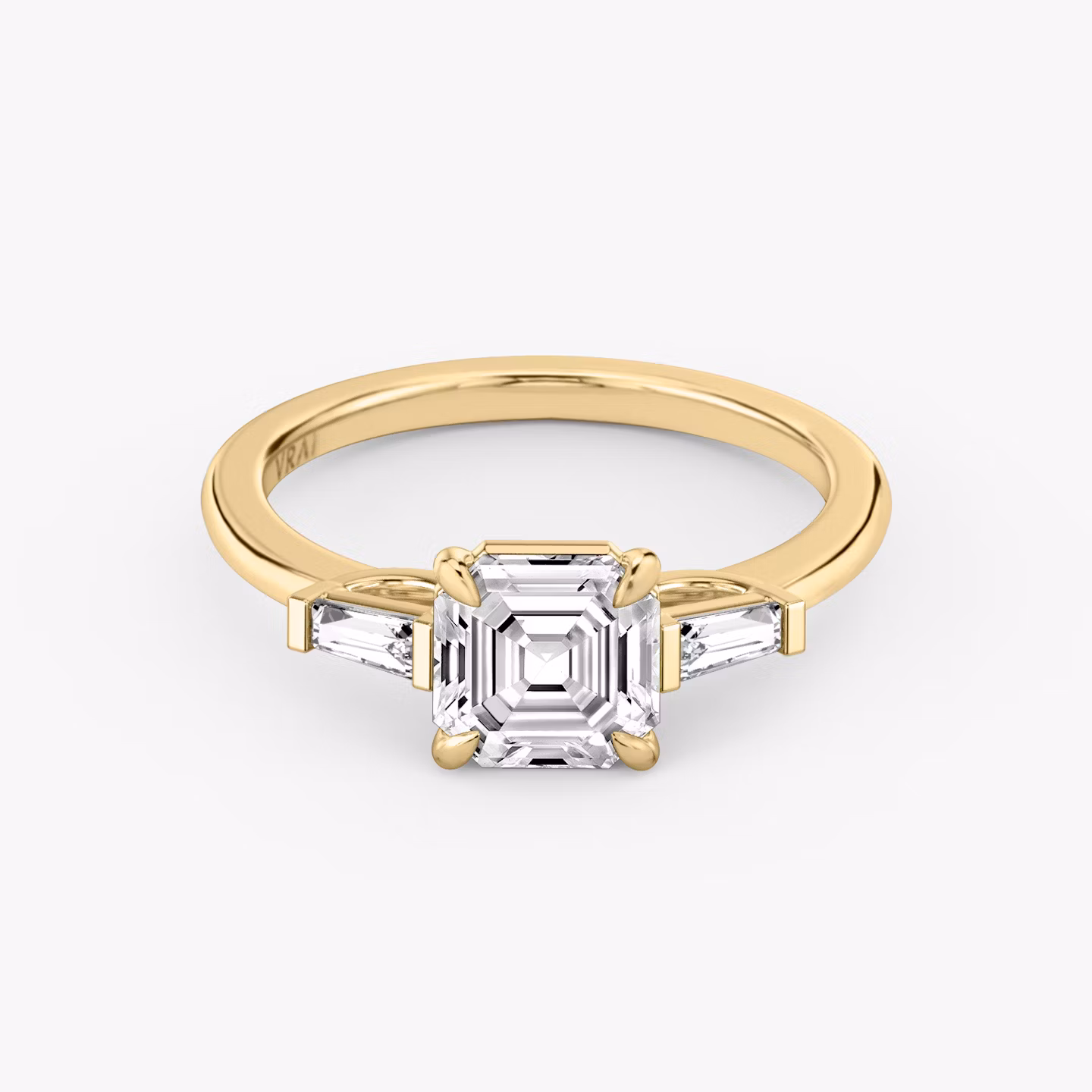 The Three Stone | Asscher | 18k | Yellow Gold | bandAccent: Plain | sideStoneCarat: 0.10ct | sideStoneShape: Tapered Baguette | diamondOrientation: vertical | caratWeight: other