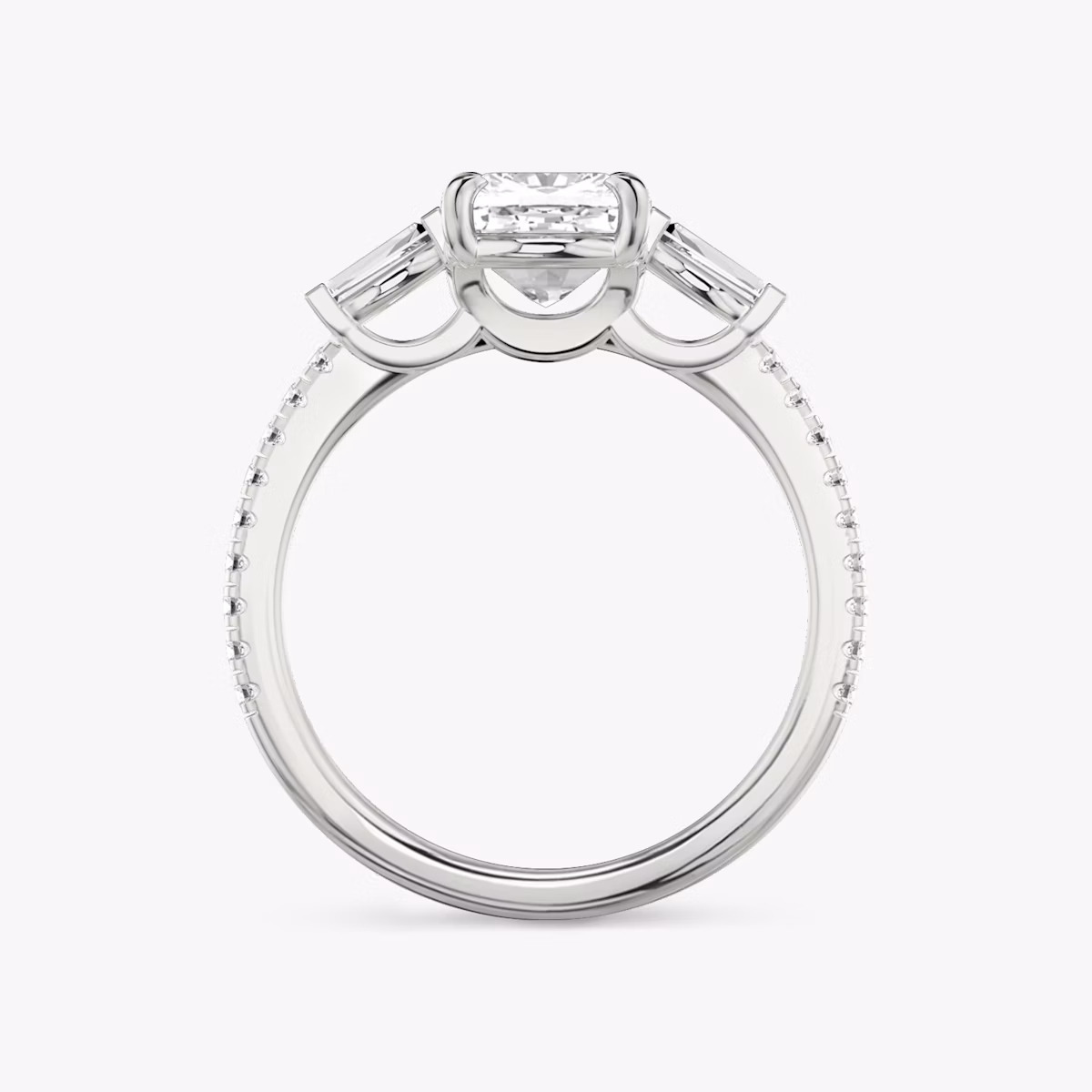 The Three Stone | Cushion | Platinum | bandAccent: Pavé | sideStoneCarat: 0.10ct | sideStoneShape: Tapered Baguette | diamondOrientation: vertical | caratWeight: other