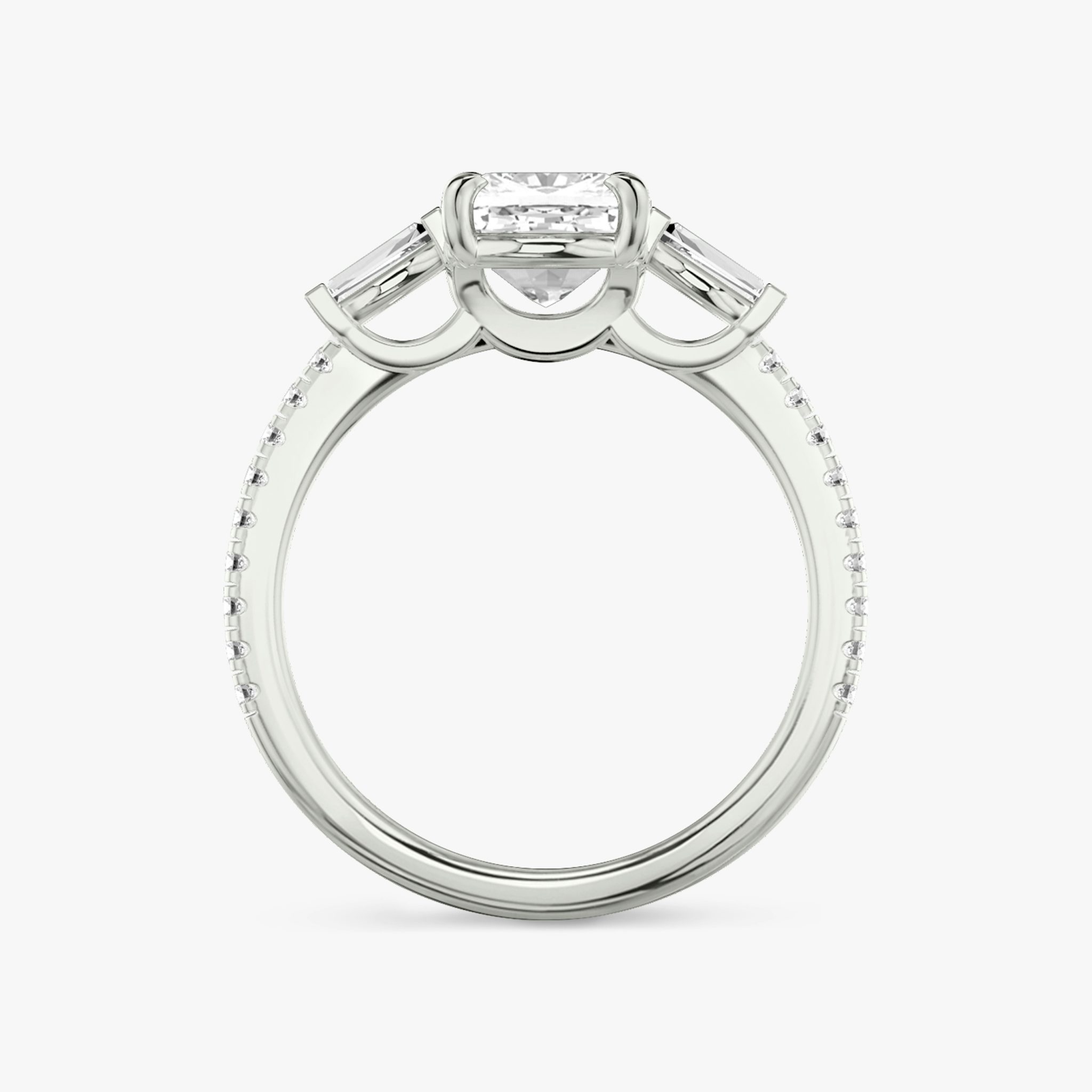 The Three Stone | Cushion | 18k | White Gold | bandAccent: Pavé | sideStoneCarat: 0.10ct | sideStoneShape: Tapered Baguette | diamondOrientation: vertical | caratWeight: other