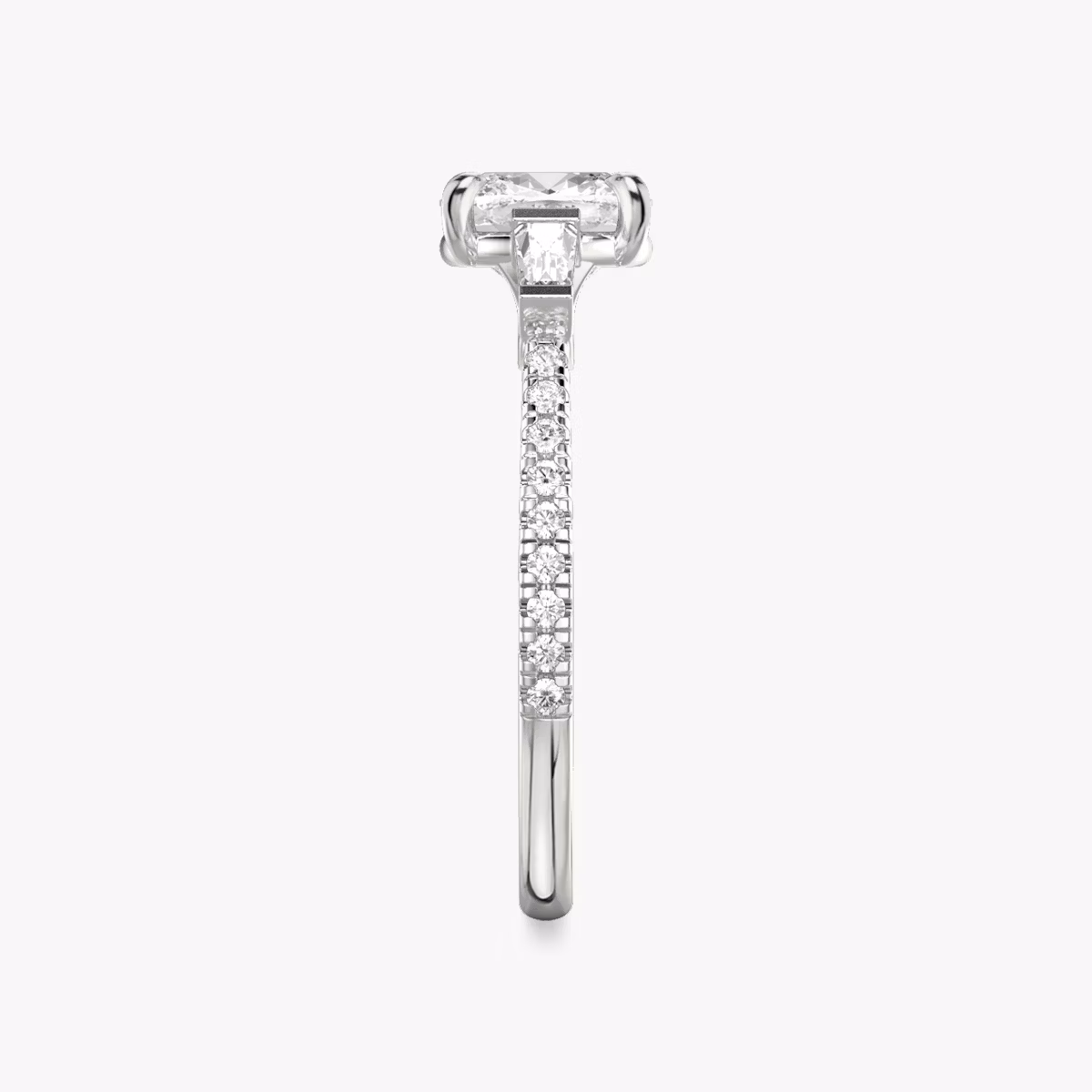 The Three Stone | Cushion | Platinum | bandAccent: Pavé | sideStoneCarat: 0.10ct | sideStoneShape: Tapered Baguette | diamondOrientation: vertical | caratWeight: other