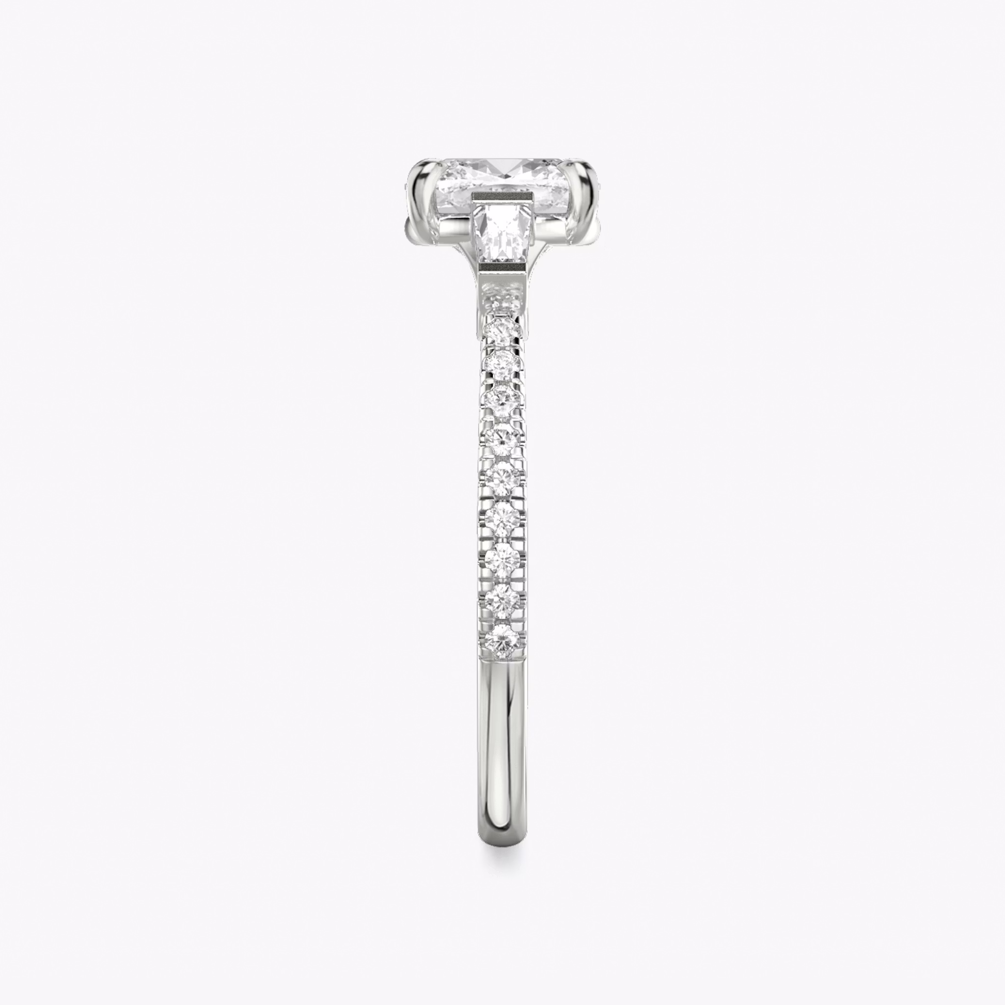 The Three Stone | Cushion | 18k | White Gold | bandAccent: Pavé | sideStoneCarat: 0.10ct | sideStoneShape: Tapered Baguette | diamondOrientation: vertical | caratWeight: other