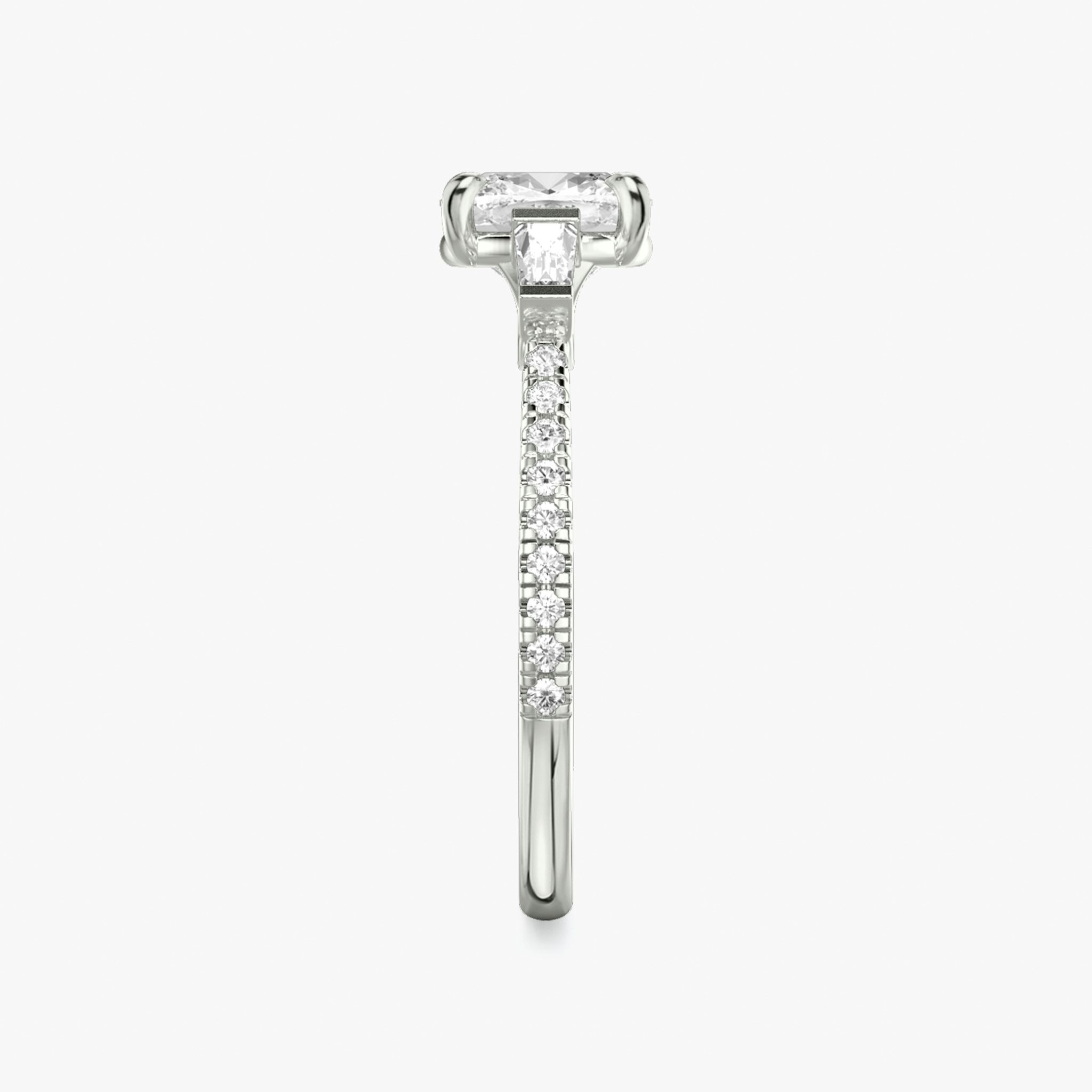 The Three Stone | Cushion | 18k | White Gold | bandAccent: Pavé | sideStoneCarat: 0.10ct | sideStoneShape: Tapered Baguette | diamondOrientation: vertical | caratWeight: other
