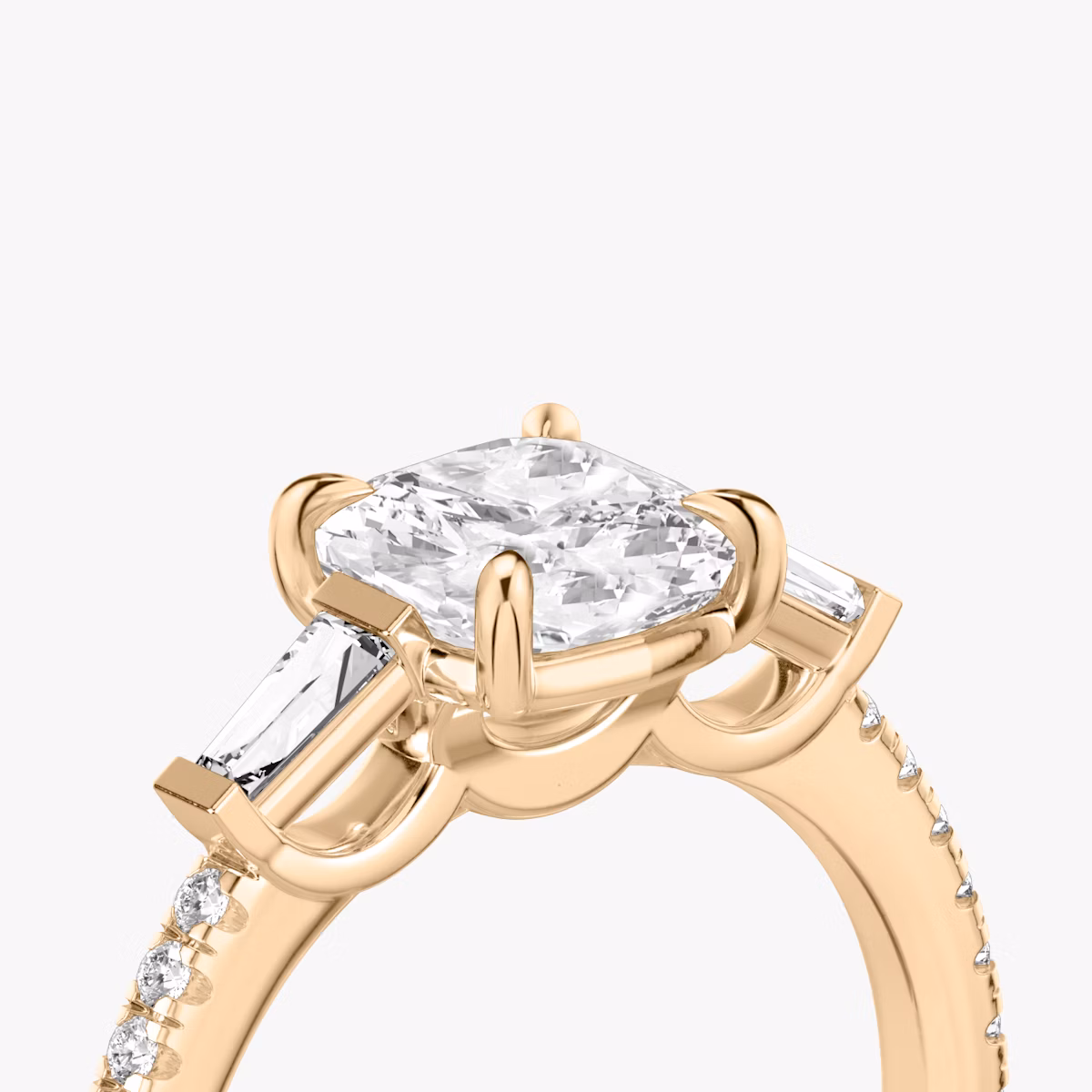 The Three Stone | Cushion | 14k | Rose Gold | bandAccent: Pavé | sideStoneCarat: 0.10ct | sideStoneShape: Tapered Baguette | diamondOrientation: vertical | caratWeight: other