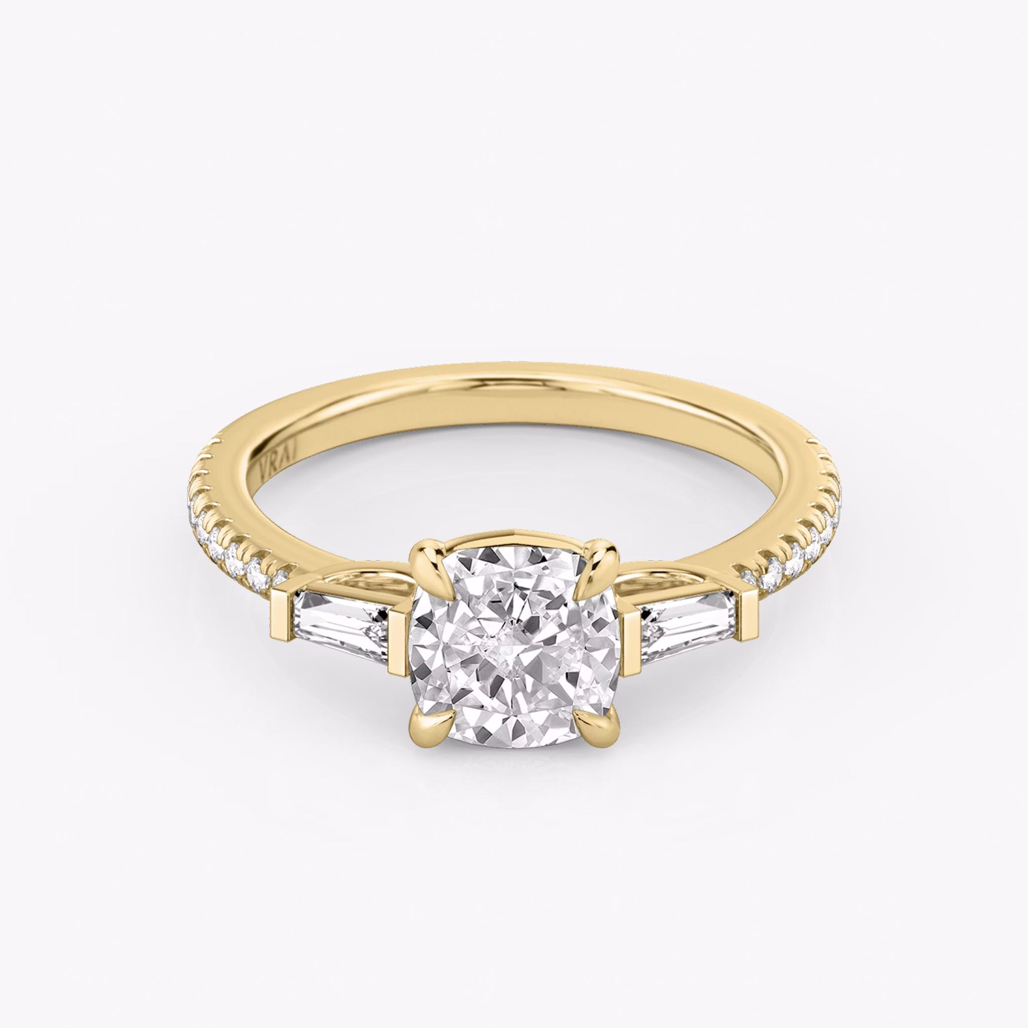 The Three Stone | Cushion | 18k | Yellow Gold | bandAccent: Pavé | sideStoneCarat: 0.10ct | sideStoneShape: Tapered Baguette | diamondOrientation: vertical | caratWeight: other
