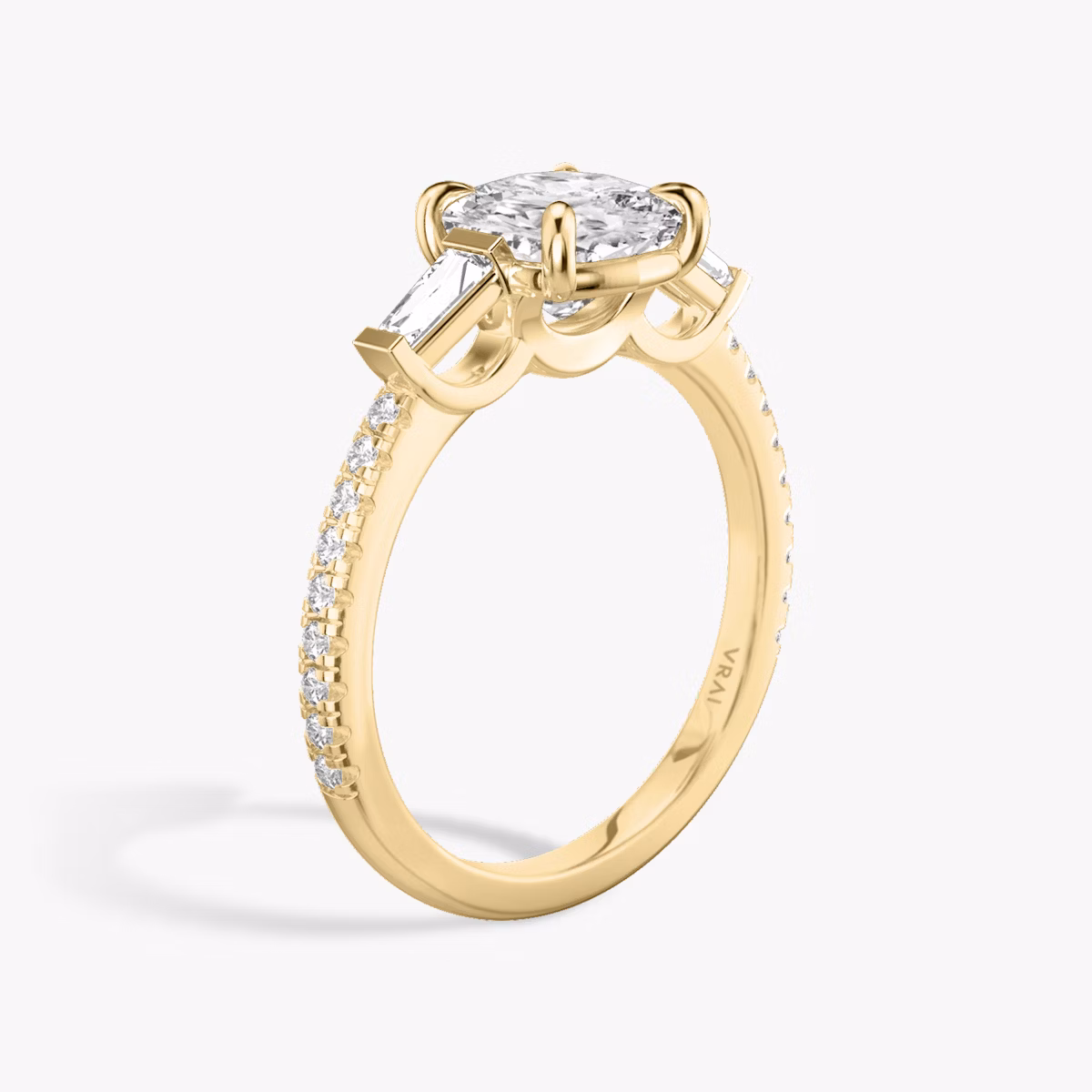The Three Stone | Cushion | 18k | Yellow Gold | bandAccent: Pavé | sideStoneCarat: 0.10ct | sideStoneShape: Tapered Baguette | diamondOrientation: vertical | caratWeight: other