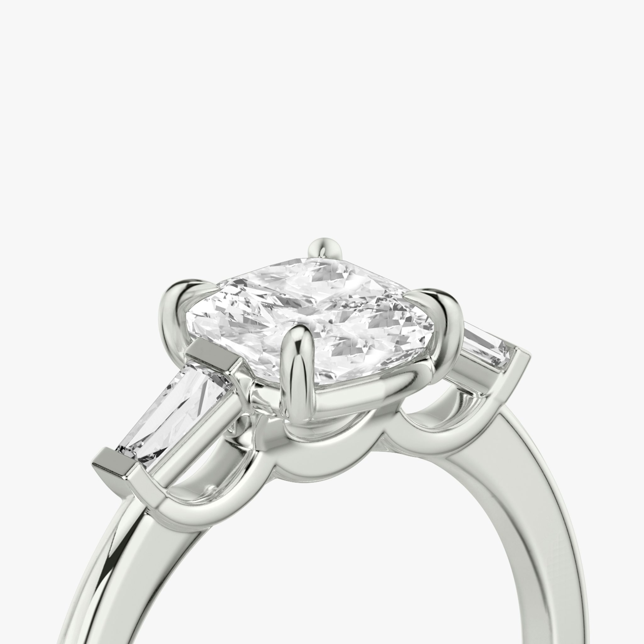 The Three Stone | Cushion | 18k | White Gold | bandAccent: Plain | sideStoneCarat: 0.10ct | sideStoneShape: Tapered Baguette | diamondOrientation: vertical | caratWeight: other
