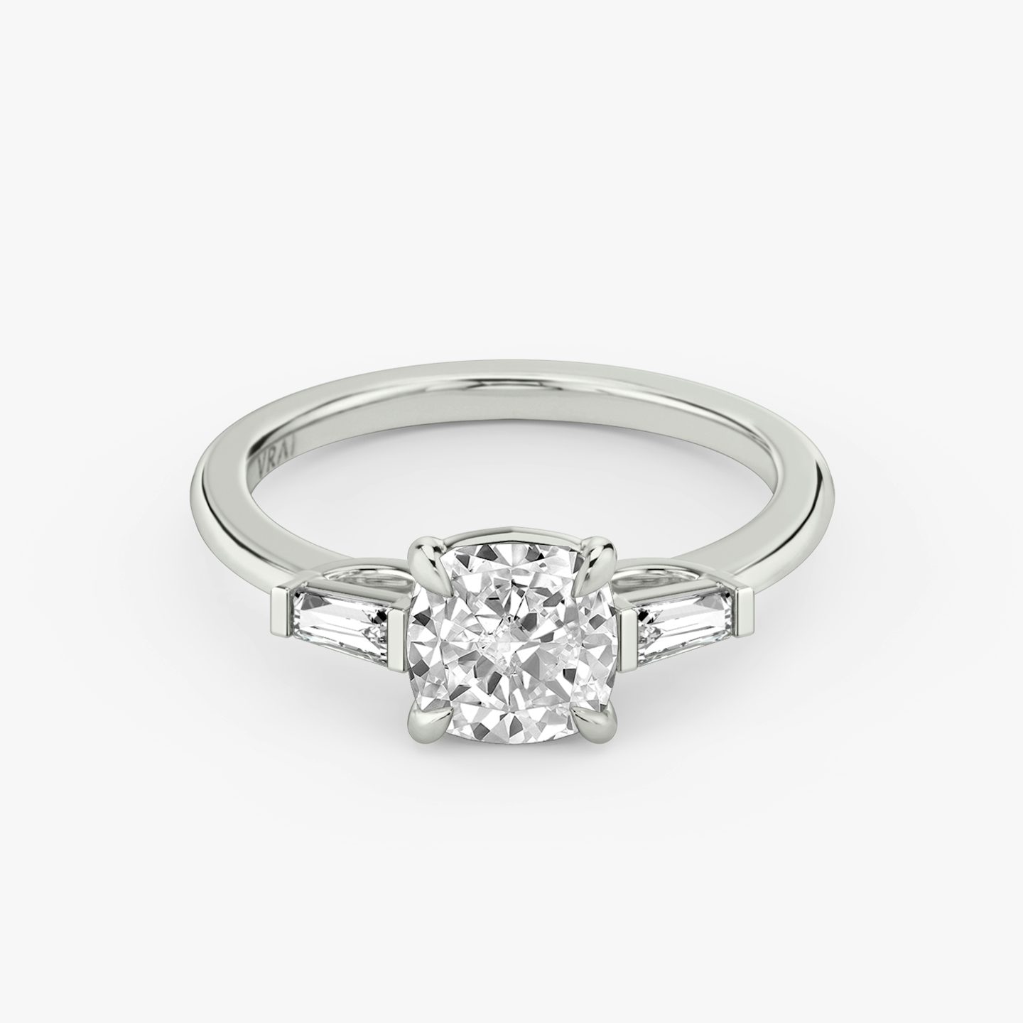 The Three Stone | Cushion | Platinum | bandAccent: Plain | sideStoneCarat: 0.10ct | sideStoneShape: Tapered Baguette | diamondOrientation: vertical | caratWeight: other