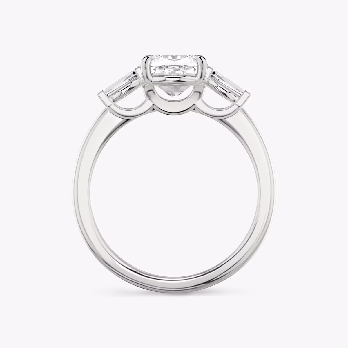 The Three Stone | Cushion | Platinum | bandAccent: Plain | sideStoneCarat: 0.10ct | sideStoneShape: Tapered Baguette | diamondOrientation: vertical | caratWeight: other