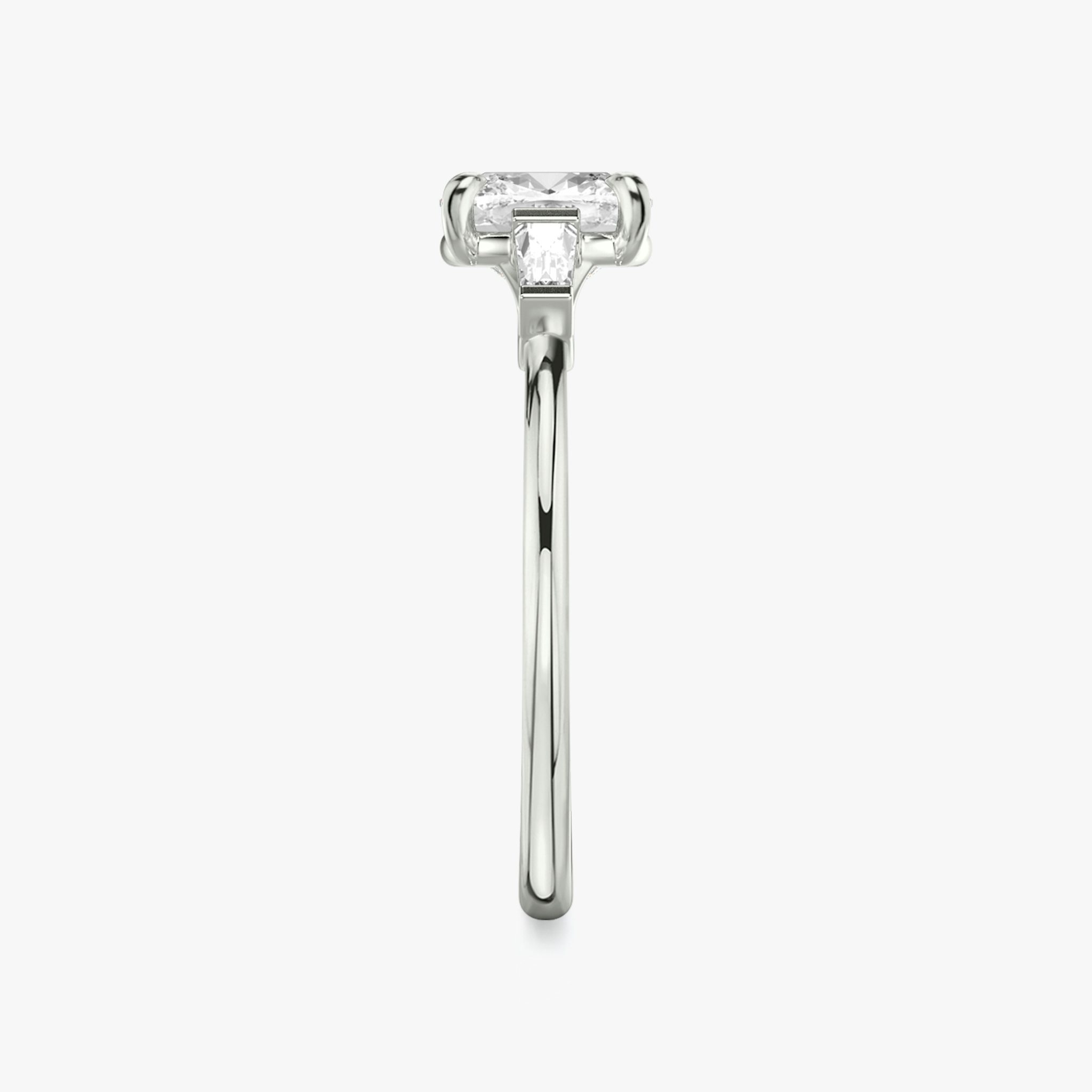 The Three Stone | Cushion | 18k | White Gold | bandAccent: Plain | sideStoneCarat: 0.10ct | sideStoneShape: Tapered Baguette | diamondOrientation: vertical | caratWeight: other