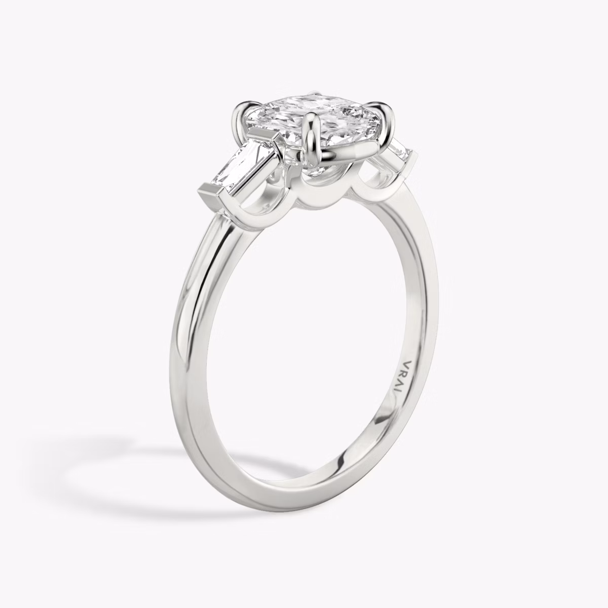 The Three Stone | Cushion | Platinum | bandAccent: Plain | sideStoneCarat: 0.10ct | sideStoneShape: Tapered Baguette | diamondOrientation: vertical | caratWeight: other