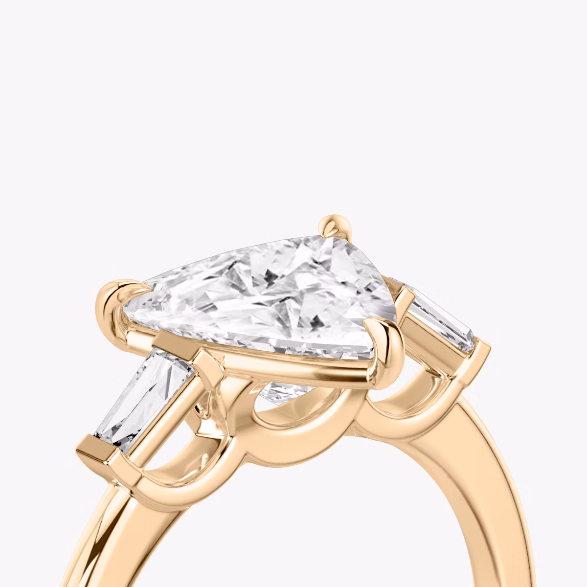 The Three Stone | Trillion | 14k | Rose Gold | bandAccent: Plain | sideStoneCarat: 0.10ct | sideStoneShape: Tapered Baguette | diamondOrientation: vertical | caratWeight: other