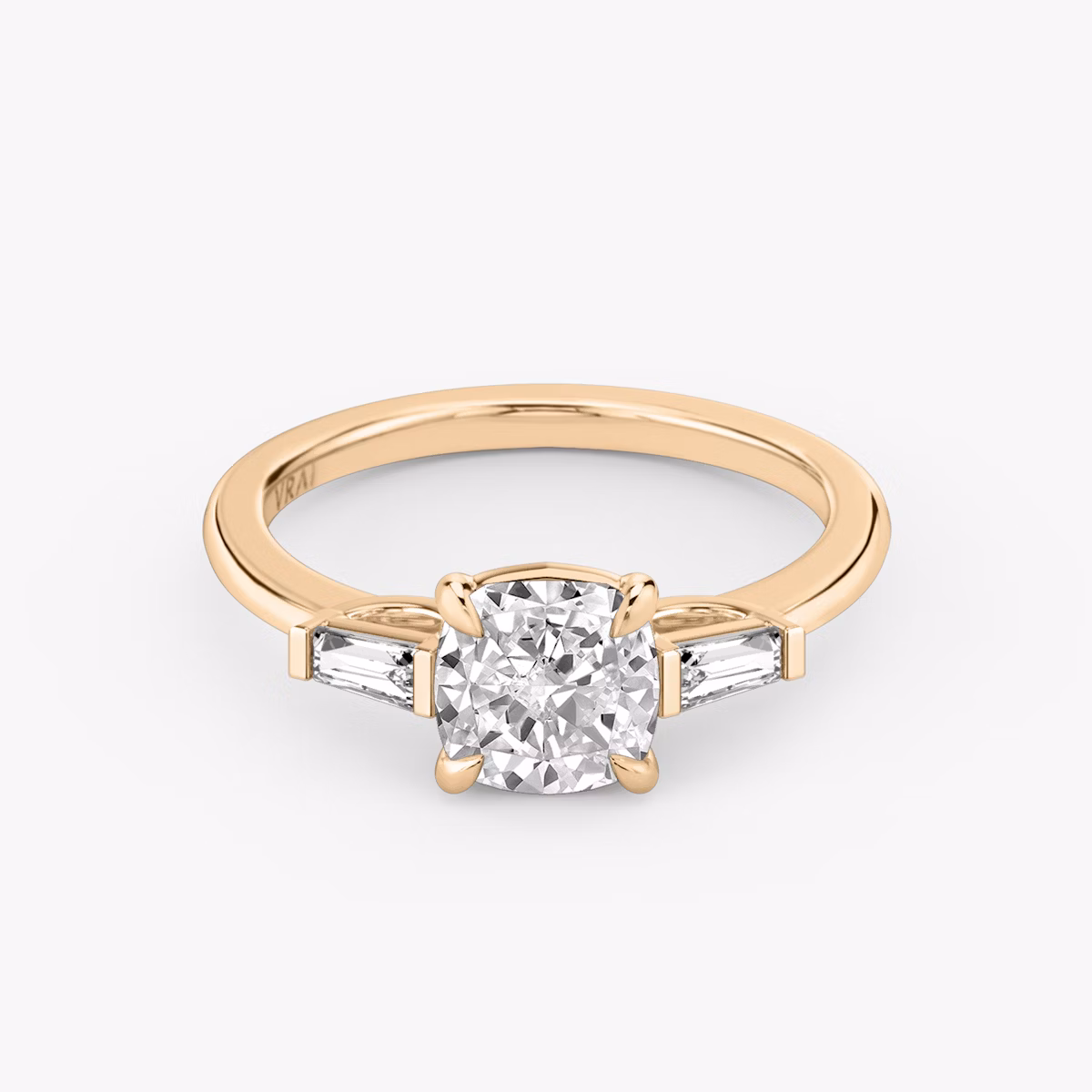 The Three Stone | Cushion | 14k | Rose Gold | bandAccent: Plain | sideStoneCarat: 0.10ct | sideStoneShape: Tapered Baguette | diamondOrientation: vertical | caratWeight: other