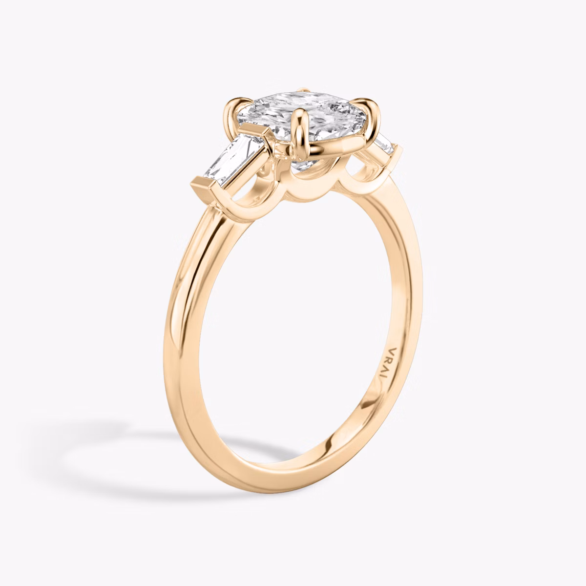 The Three Stone | Cushion | 14k | Rose Gold | bandAccent: Plain | sideStoneCarat: 0.10ct | sideStoneShape: Tapered Baguette | diamondOrientation: vertical | caratWeight: other