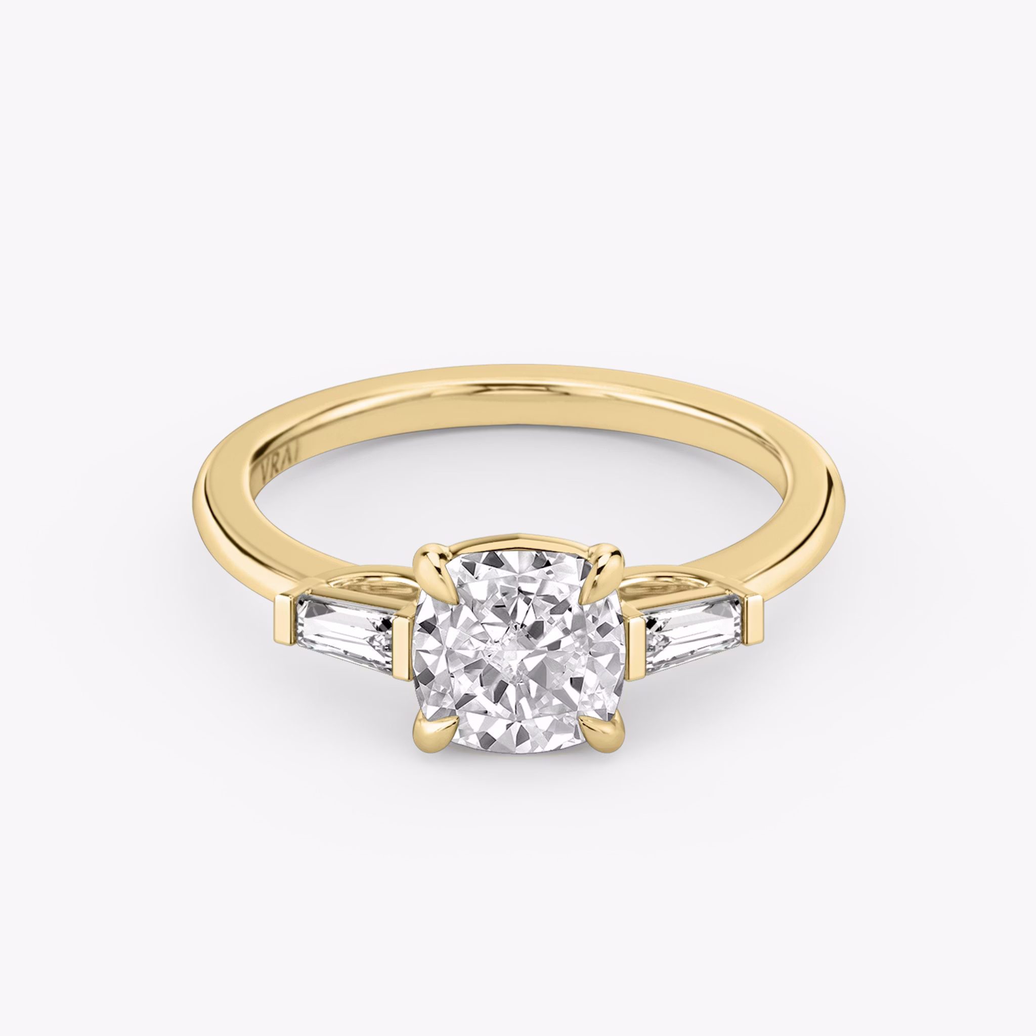 The Three Stone | Cushion | 18k | Yellow Gold | bandAccent: Plain | sideStoneCarat: 0.10ct | sideStoneShape: Tapered Baguette | diamondOrientation: vertical | caratWeight: other