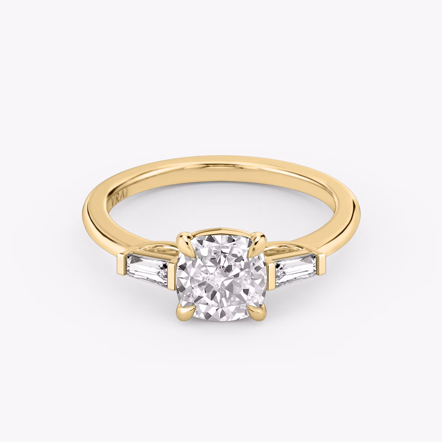 The Three Stone | Cushion | 18k | Yellow Gold | bandAccent: Plain | sideStoneCarat: 0.10ct | sideStoneShape: Tapered Baguette | diamondOrientation: vertical | caratWeight: other