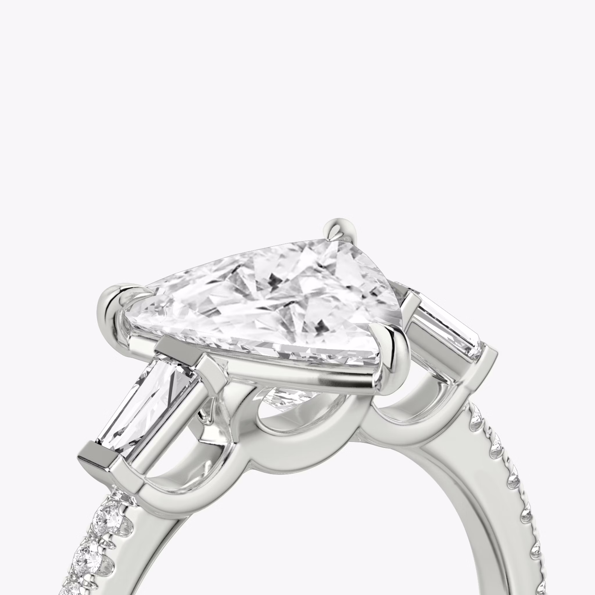 The Three Stone | Trillion | 18k | White Gold | bandAccent: Pavé | sideStoneCarat: 0.10ct | sideStoneShape: Tapered Baguette | diamondOrientation: vertical | caratWeight: other