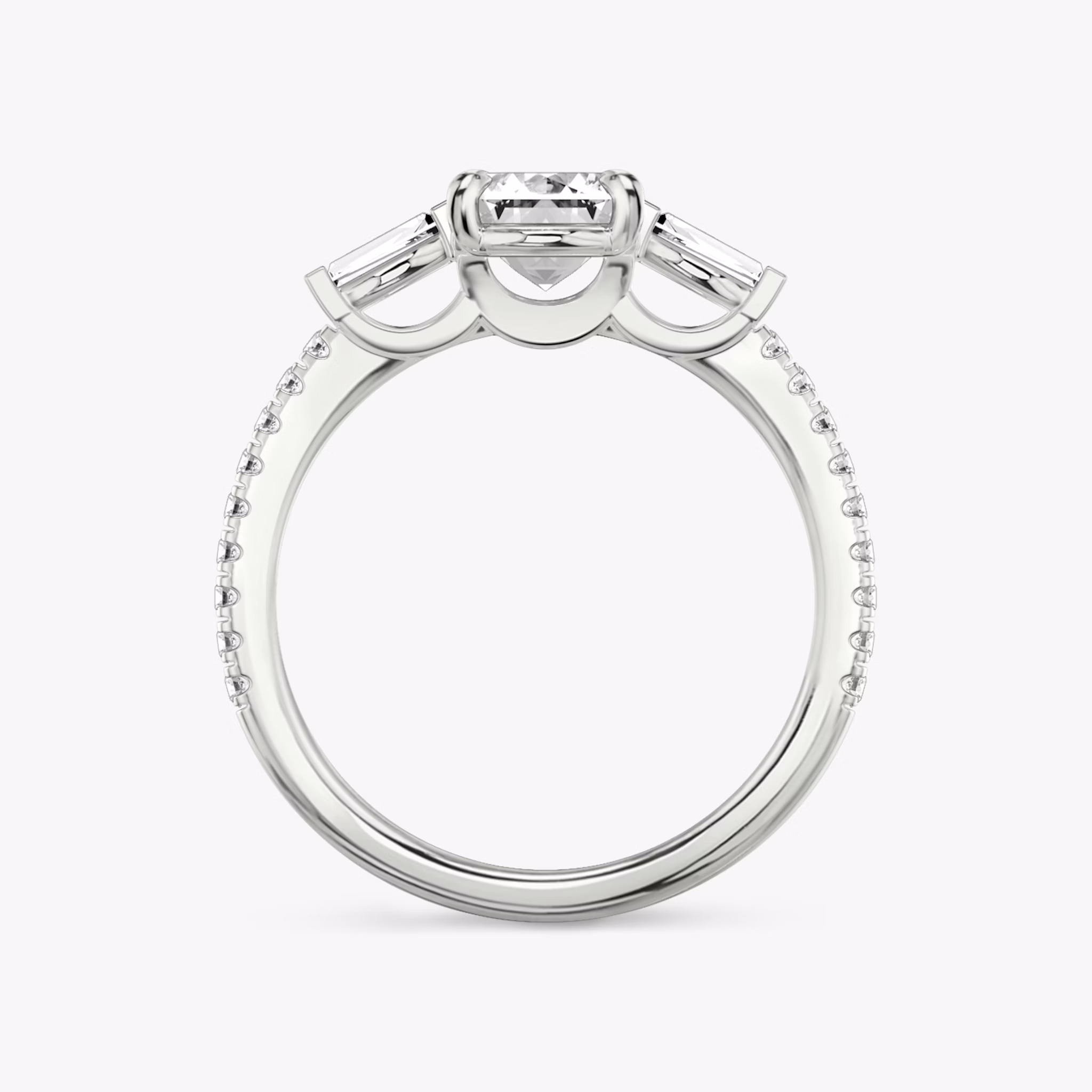 The Three Stone | Emerald | 18k | White Gold | bandAccent: Pavé | sideStoneCarat: 0.10ct | sideStoneShape: Tapered Baguette | diamondOrientation: vertical | caratWeight: other