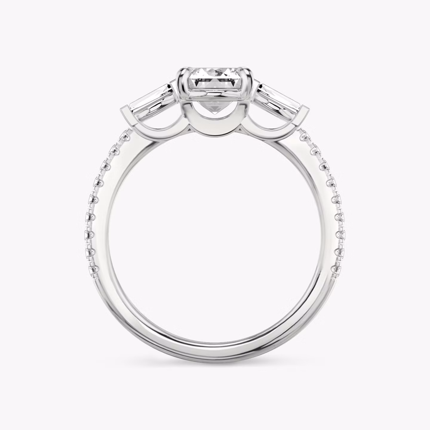 The Three Stone | Emerald | 18k | White Gold | bandAccent: Pavé | sideStoneCarat: 0.10ct | sideStoneShape: Tapered Baguette | diamondOrientation: vertical | caratWeight: other