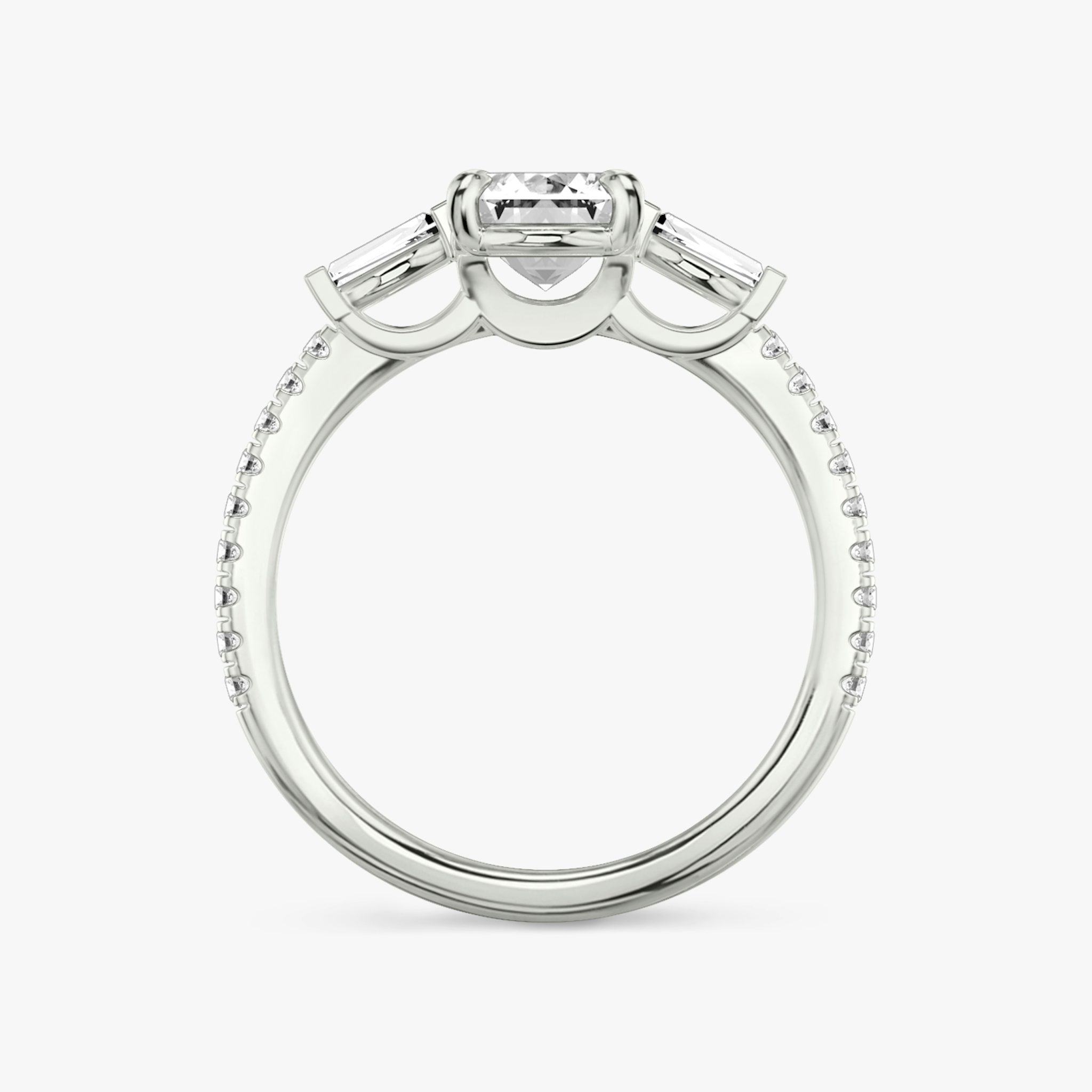 The Three Stone | Emerald | 18k | White Gold | bandAccent: Pavé | sideStoneCarat: 0.10ct | sideStoneShape: Tapered Baguette | diamondOrientation: vertical | caratWeight: other