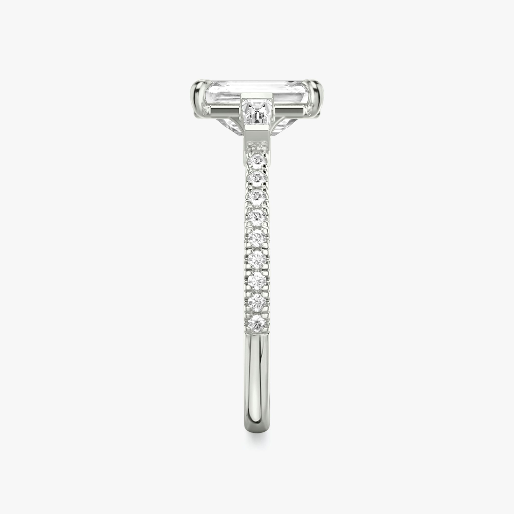 The Three Stone | Emerald | 18k | White Gold | bandAccent: Pavé | sideStoneCarat: 0.10ct | sideStoneShape: Tapered Baguette | diamondOrientation: vertical | caratWeight: other