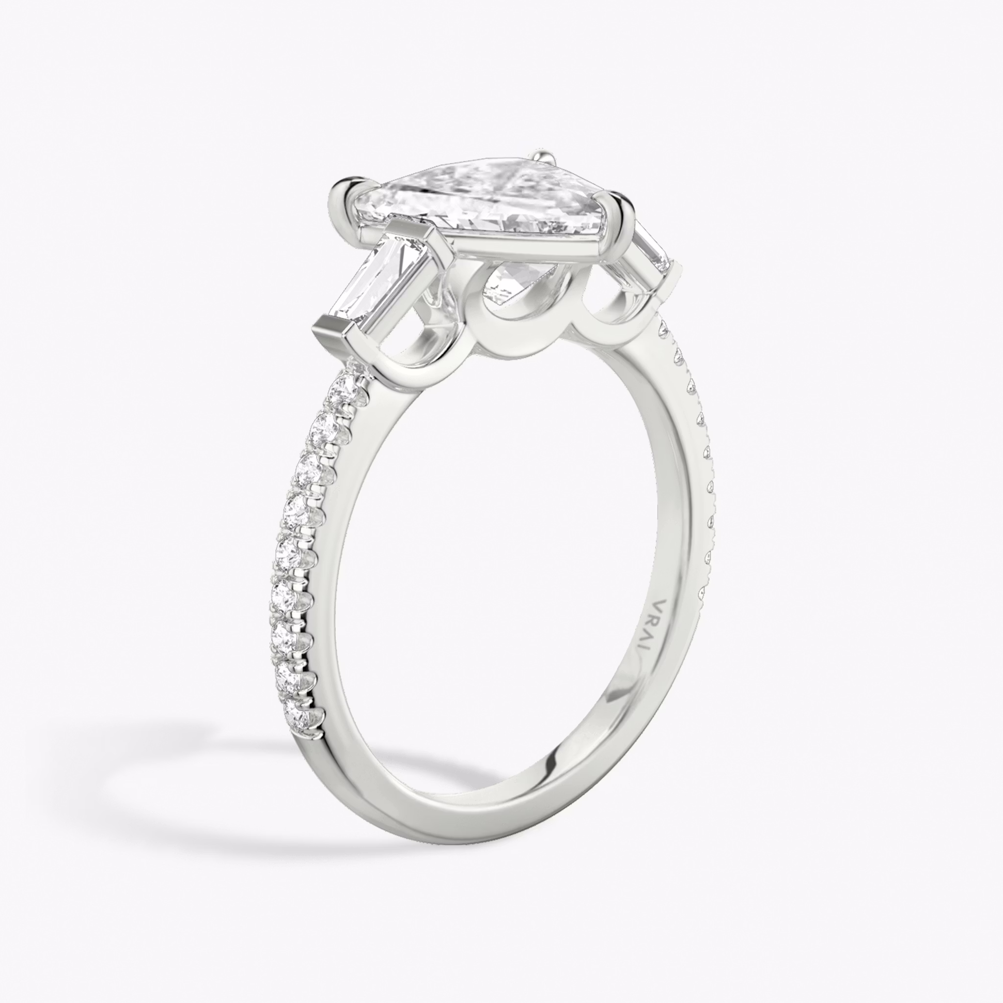 The Three Stone | Trillion | 18k | White Gold | bandAccent: Pavé | sideStoneCarat: 0.10ct | sideStoneShape: Tapered Baguette | diamondOrientation: vertical | caratWeight: other