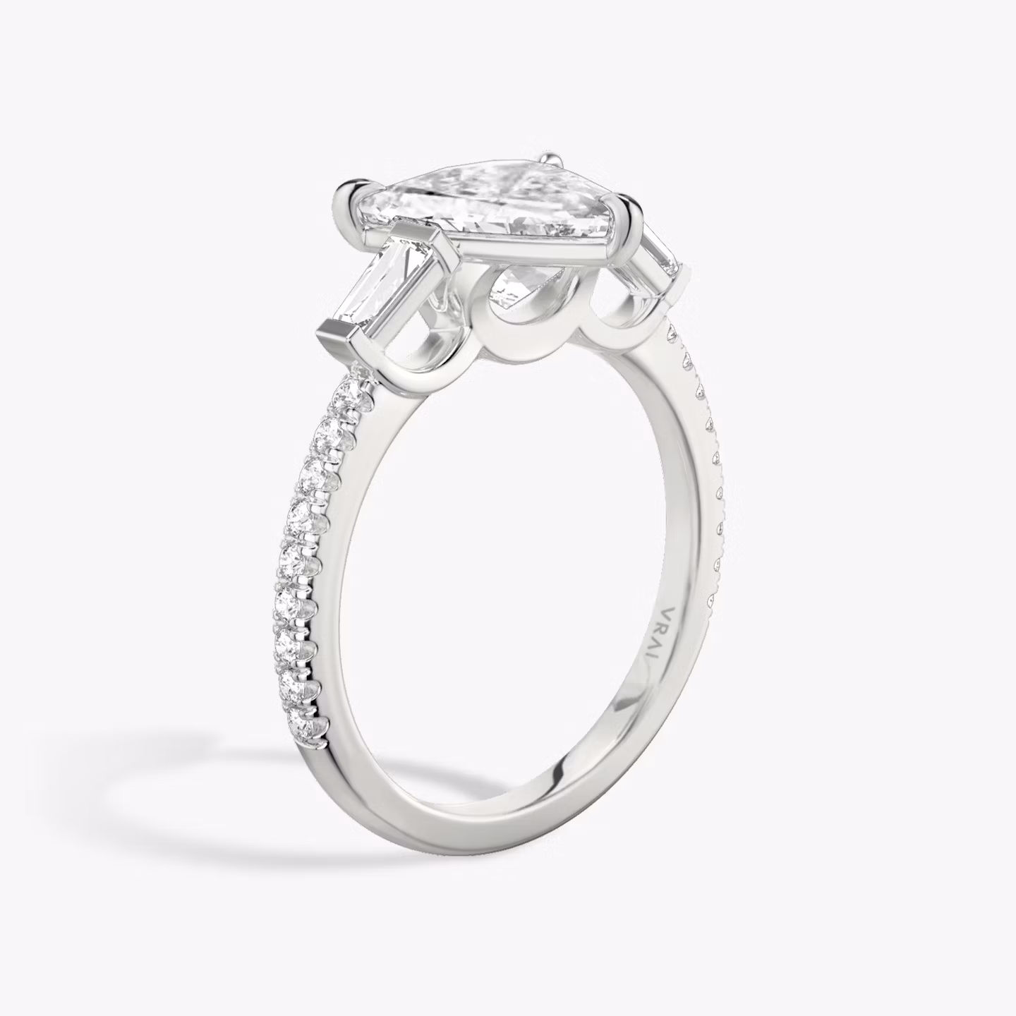 The Three Stone | Trillion | Platinum | bandAccent: Pavé | sideStoneCarat: 0.10ct | sideStoneShape: Tapered Baguette | diamondOrientation: vertical | caratWeight: other