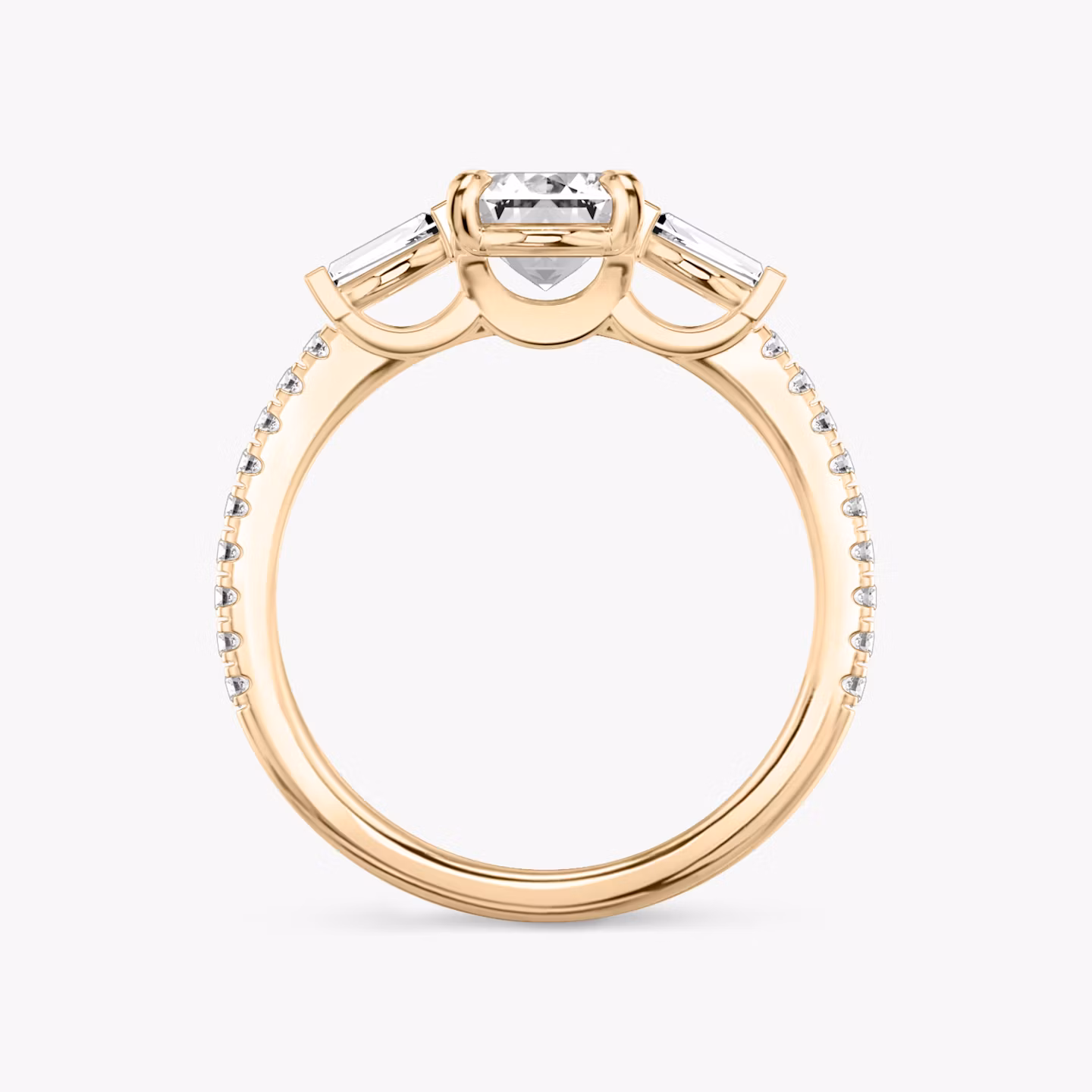 The Three Stone | Emerald | 14k | Rose Gold | bandAccent: Pavé | sideStoneCarat: 0.10ct | sideStoneShape: Tapered Baguette | diamondOrientation: vertical | caratWeight: other