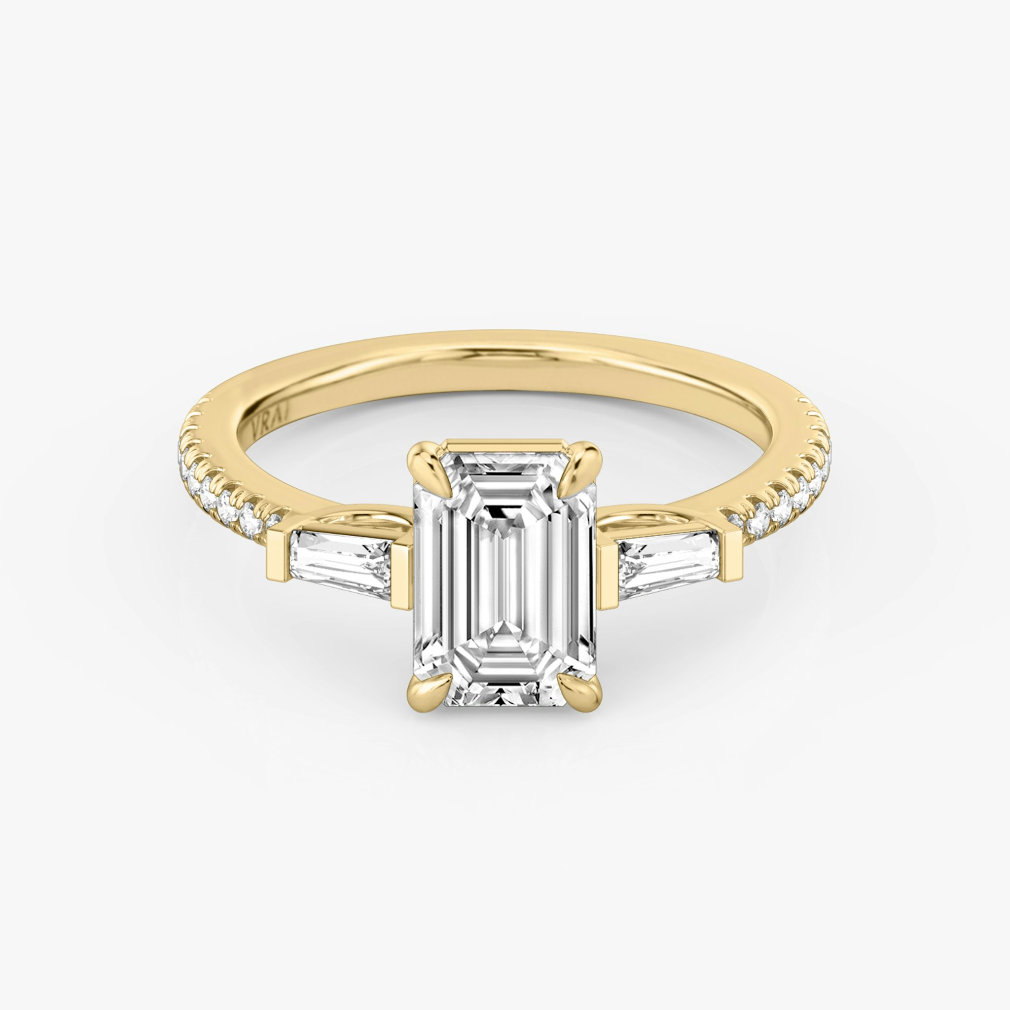 The Three Stone | Emerald | 18k | Yellow Gold | bandAccent: Pavé | sideStoneCarat: 0.10ct | sideStoneShape: Tapered Baguette | diamondOrientation: vertical | caratWeight: other