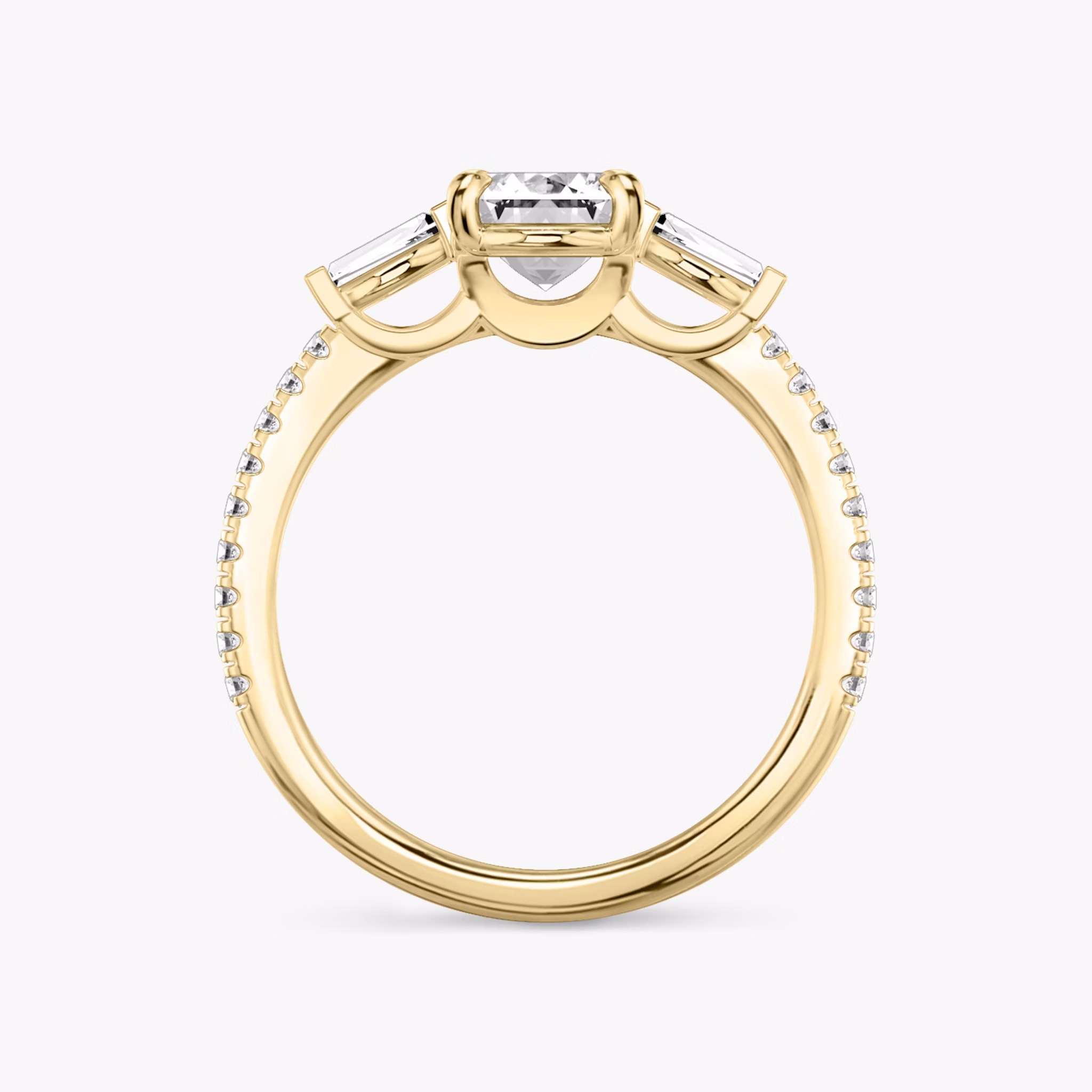 The Three Stone | Emerald | 18k | Yellow Gold | bandAccent: Pavé | sideStoneCarat: 0.10ct | sideStoneShape: Tapered Baguette | diamondOrientation: vertical | caratWeight: other