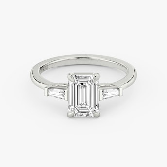 The Three Stone Emerald Platinum Engagement Ring laying flat.