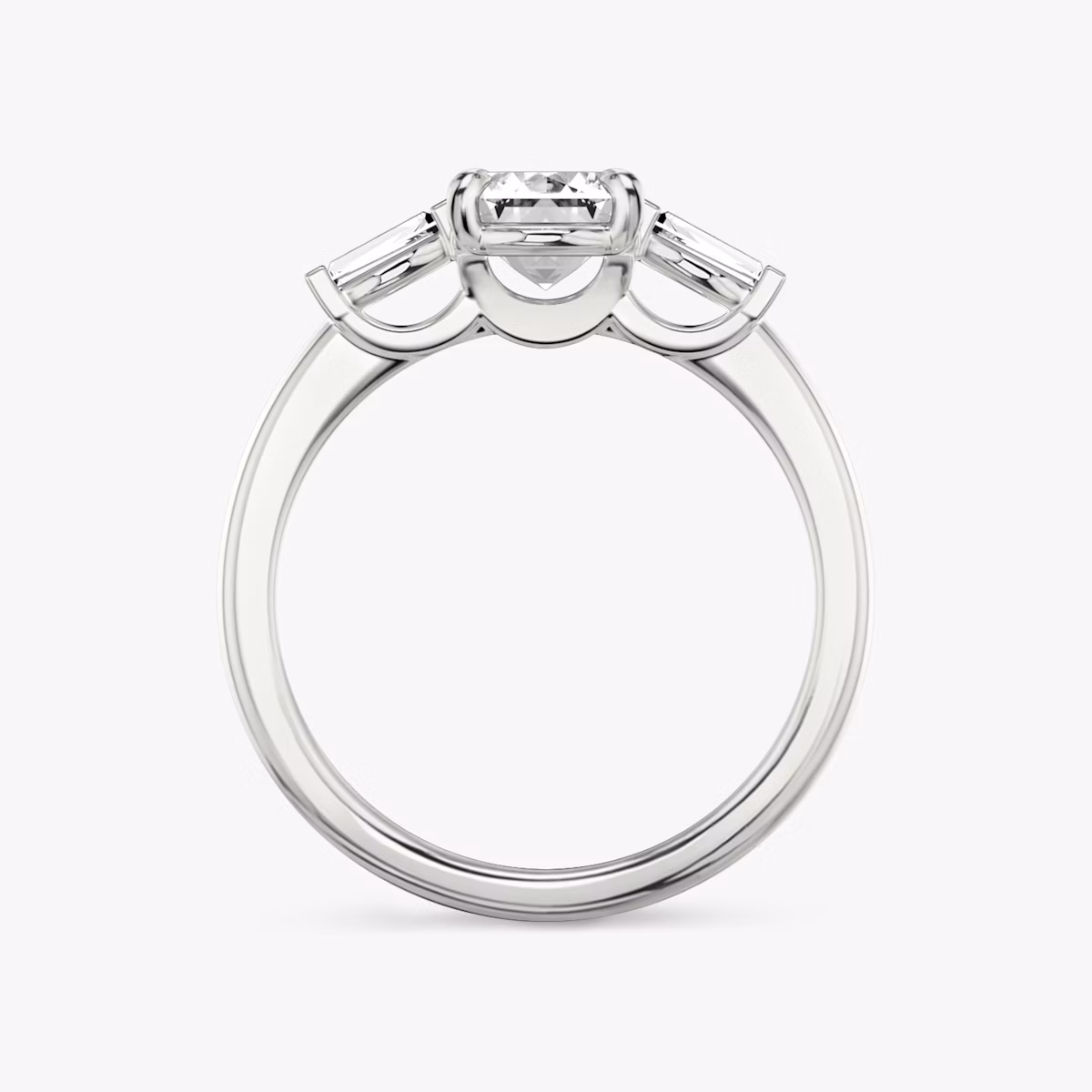 The Three Stone | Emerald | Platinum | bandAccent: Plain | sideStoneCarat: 0.10ct | sideStoneShape: Tapered Baguette | diamondOrientation: vertical | caratWeight: other