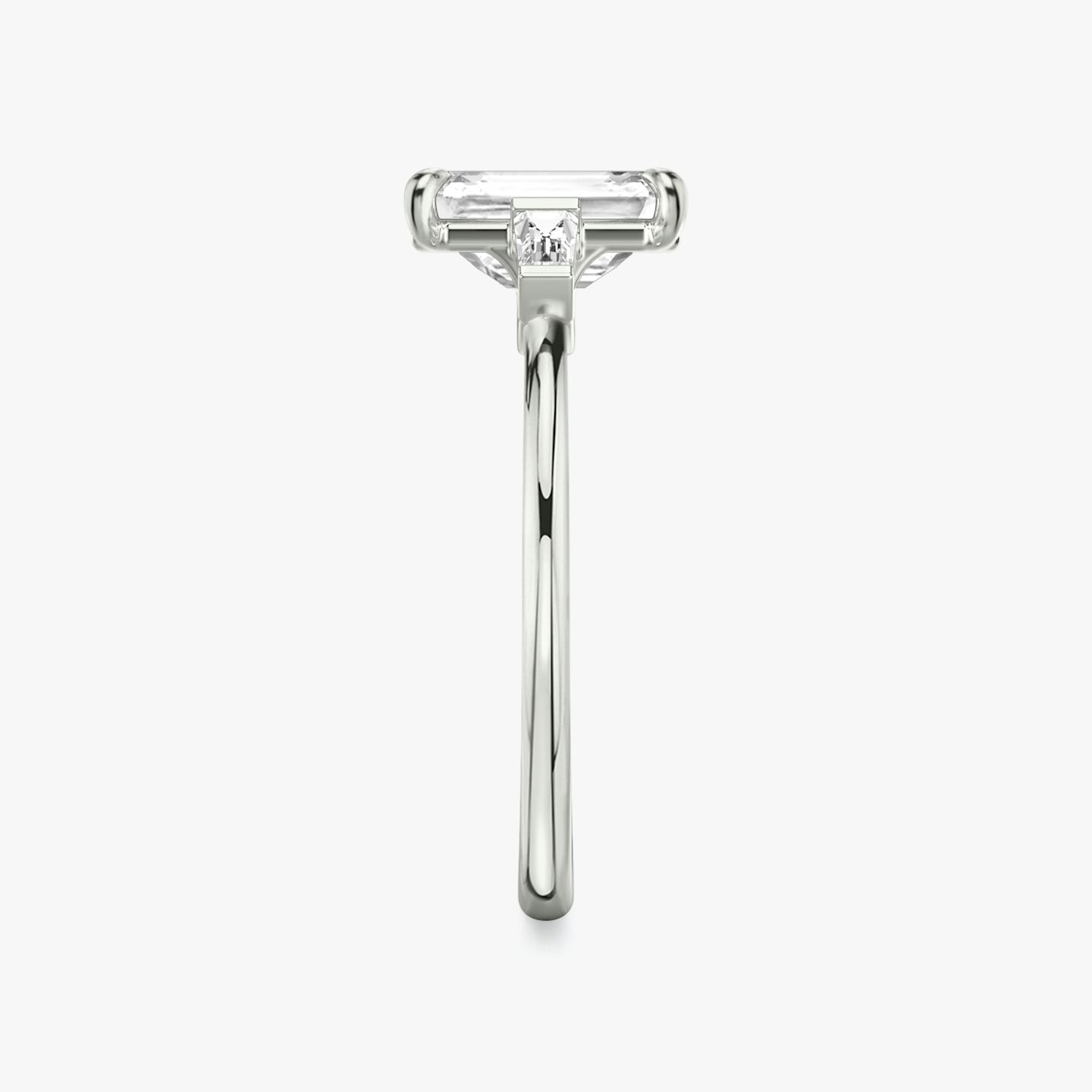 The Three Stone | Emerald | Platinum | bandAccent: Plain | sideStoneCarat: 0.10ct | sideStoneShape: Tapered Baguette | diamondOrientation: vertical | caratWeight: other