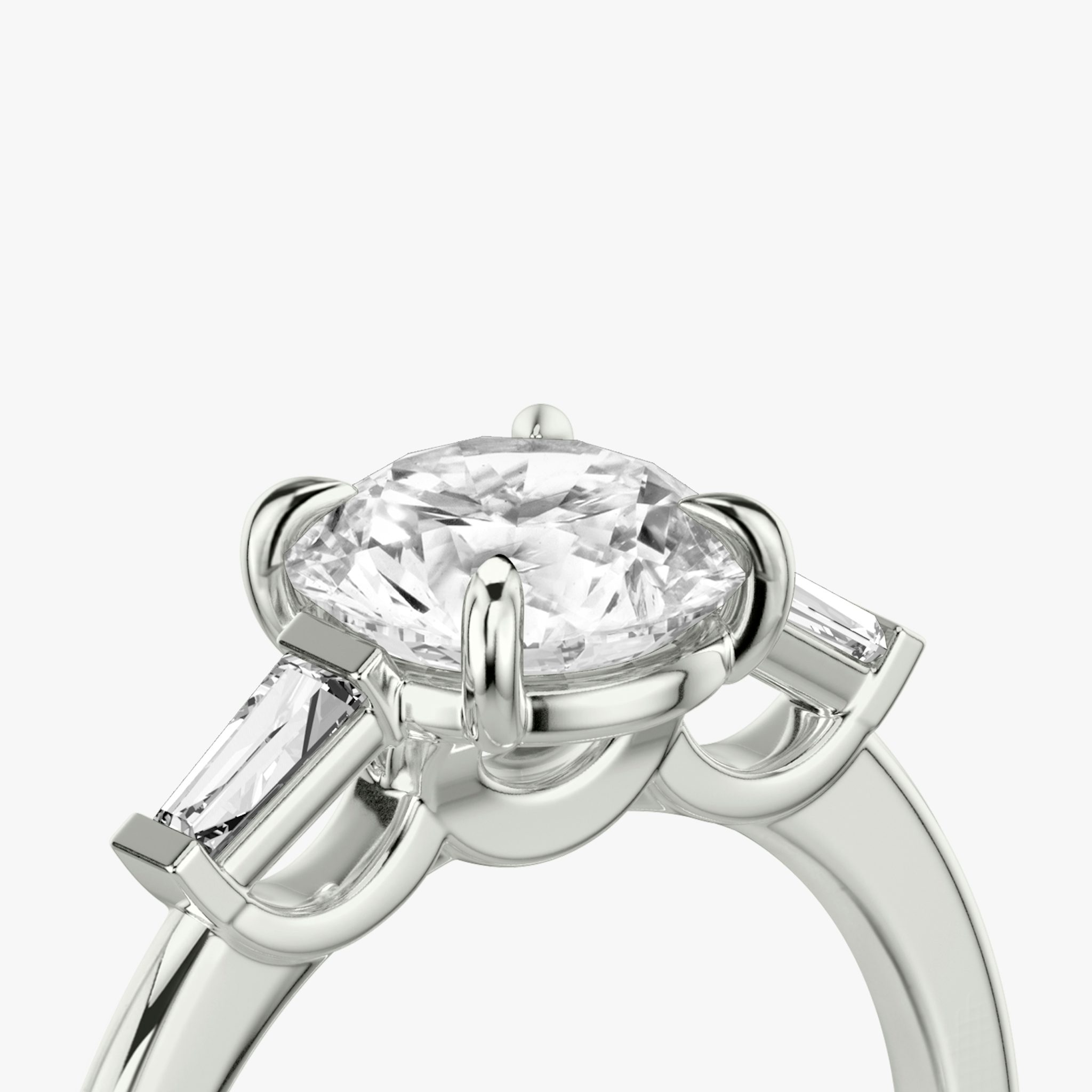 The Three Stone | Round Brilliant | 18k | White Gold | bandAccent: Plain | caratWeight: other | sideStoneCarat: 0.10ct | sideStoneShape: Tapered Baguette | diamondOrientation: vertical