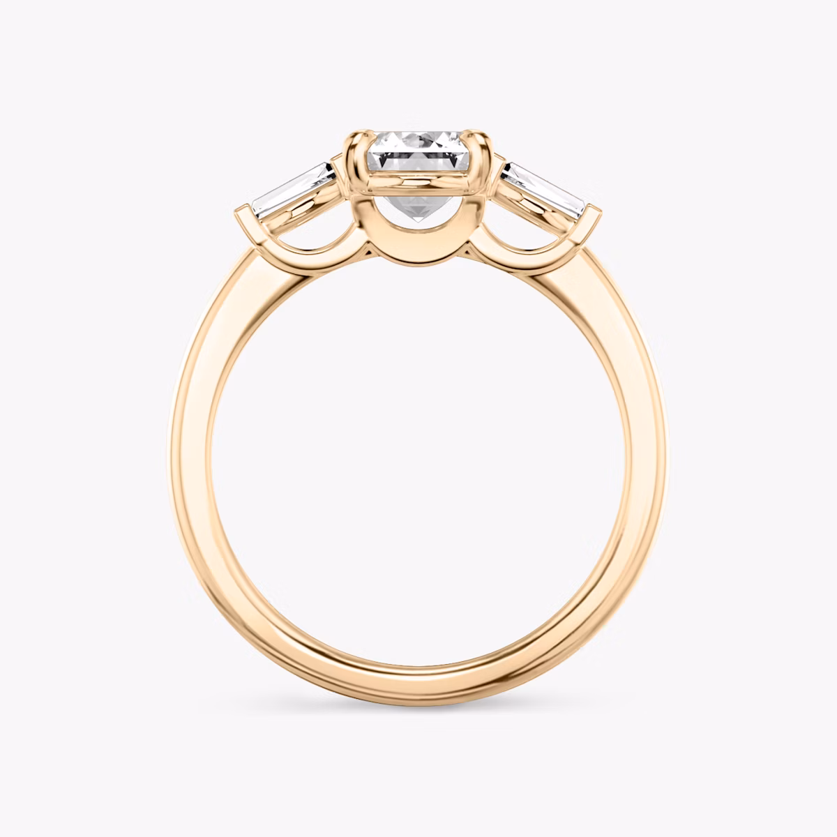 The Three Stone | Emerald | 14k | Rose Gold | bandAccent: Plain | sideStoneCarat: 0.10ct | sideStoneShape: Tapered Baguette | diamondOrientation: vertical | caratWeight: other