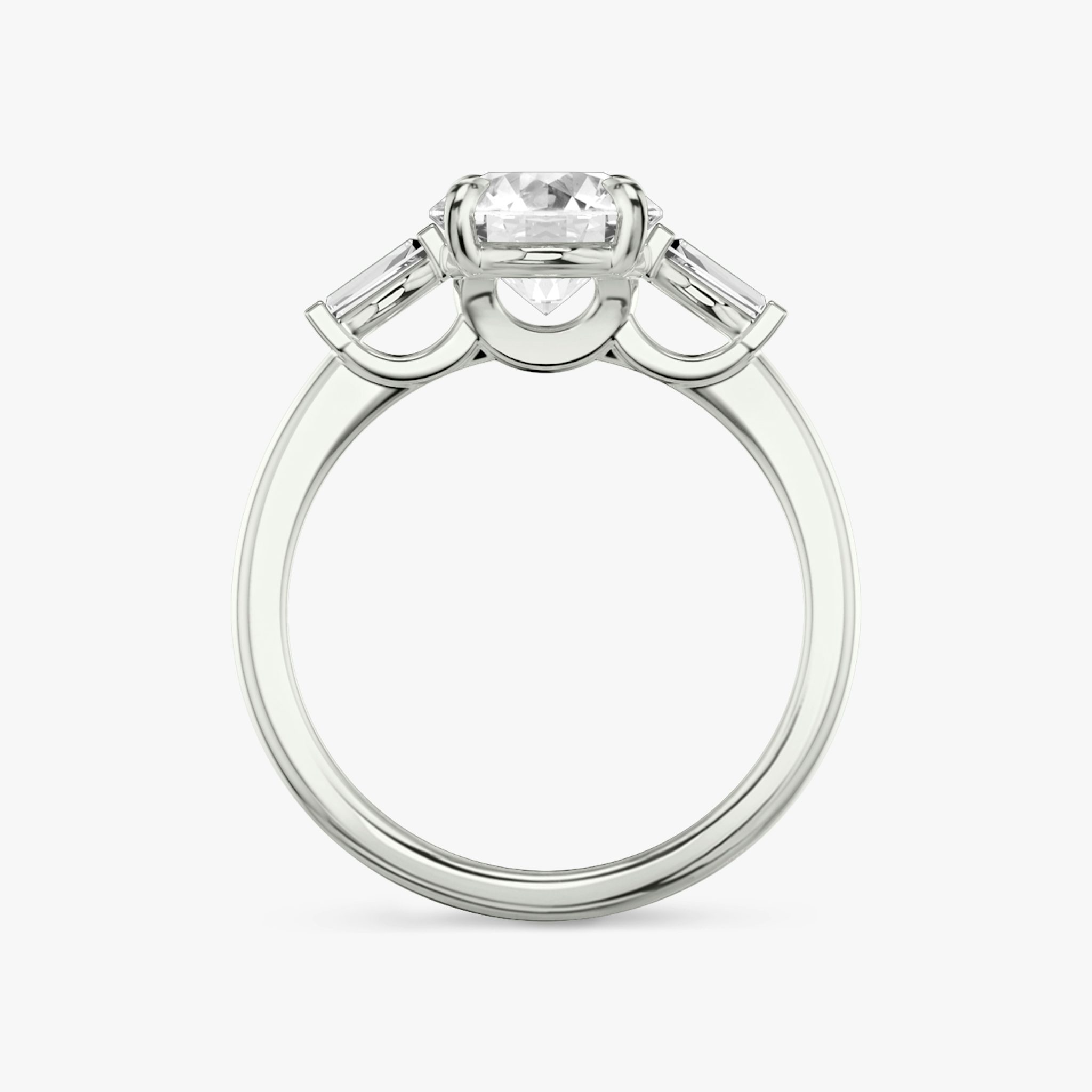 The Three Stone | Round Brilliant | 18k | White Gold | bandAccent: Plain | caratWeight: other | sideStoneCarat: 0.10ct | sideStoneShape: Tapered Baguette | diamondOrientation: vertical