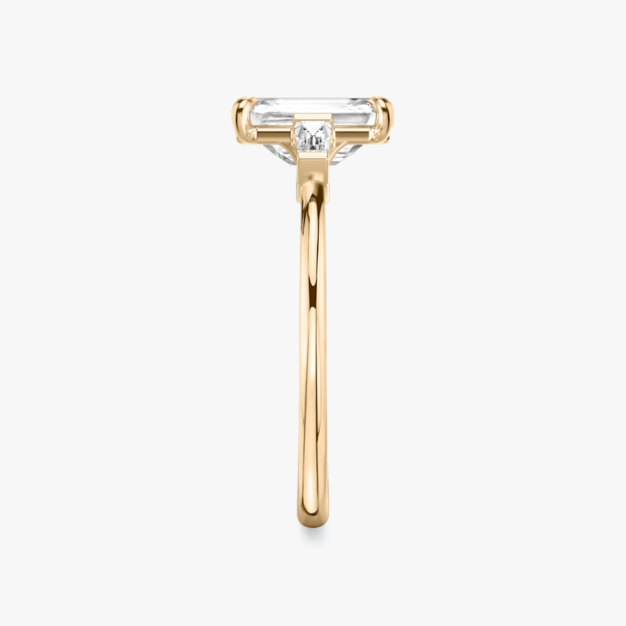 The Three Stone | Emerald | 14k | Rose Gold | bandAccent: Plain | sideStoneCarat: 0.10ct | sideStoneShape: Tapered Baguette | diamondOrientation: vertical | caratWeight: other