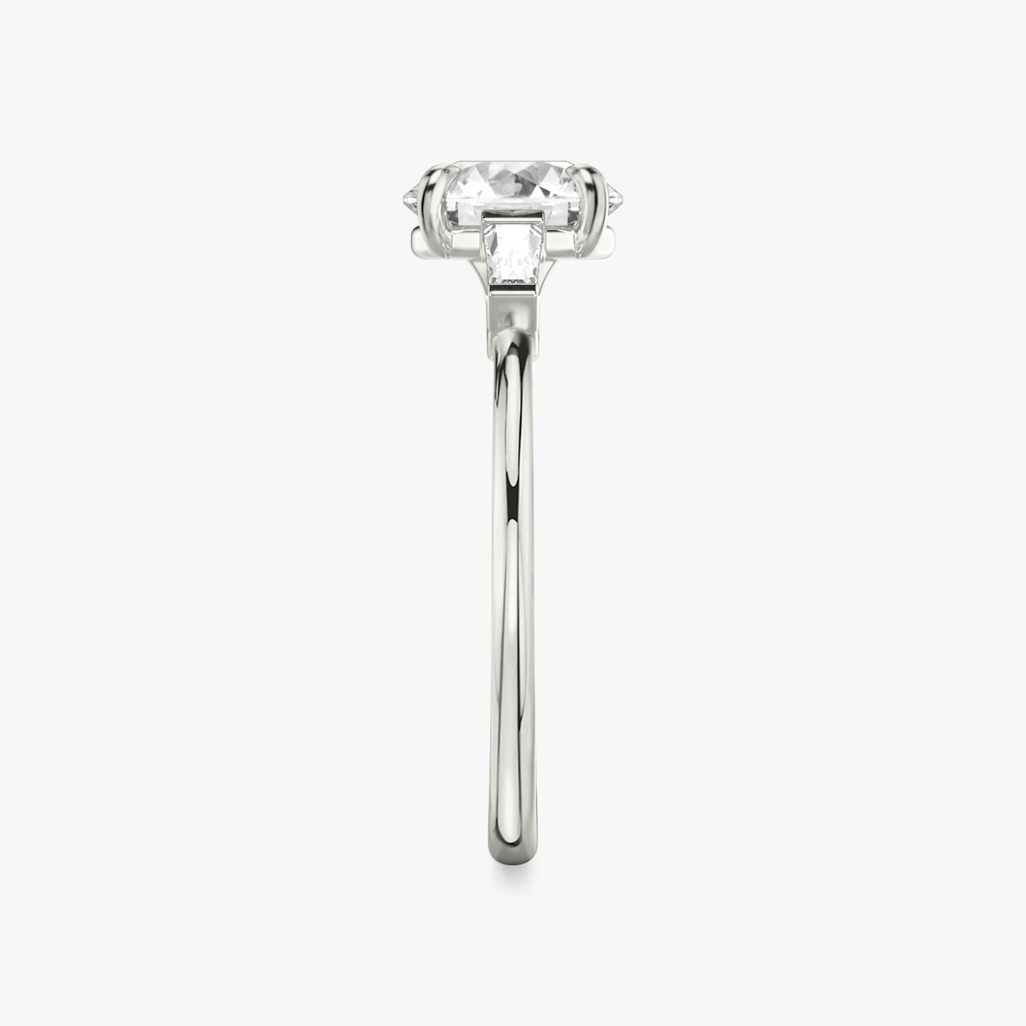 The Three Stone | Round Brilliant | Platinum | bandAccent: Plain | caratWeight: other | sideStoneCarat: 0.10ct | sideStoneShape: Tapered Baguette | diamondOrientation: vertical