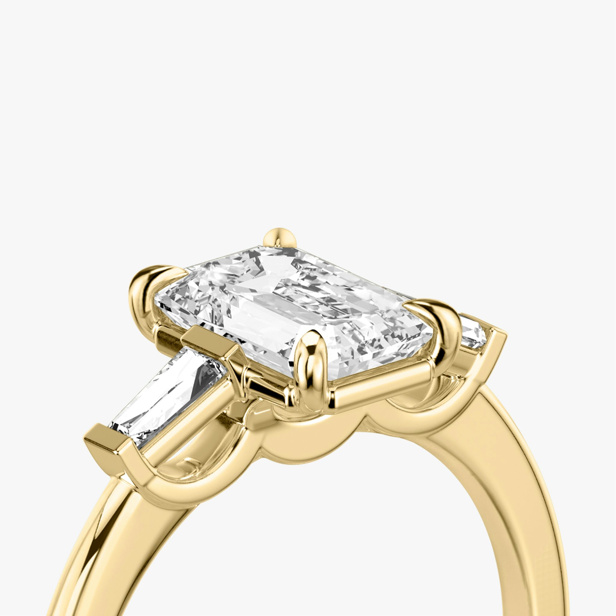 The Three Stone | Emerald | 18k | Yellow Gold | bandAccent: Plain | sideStoneCarat: 0.10ct | sideStoneShape: Tapered Baguette | diamondOrientation: vertical | caratWeight: other