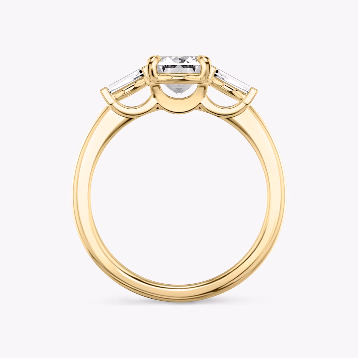 The Three Stone | Emerald | 18k | Yellow Gold | bandAccent: Plain | sideStoneCarat: 0.10ct | sideStoneShape: Tapered Baguette | diamondOrientation: vertical | caratWeight: other