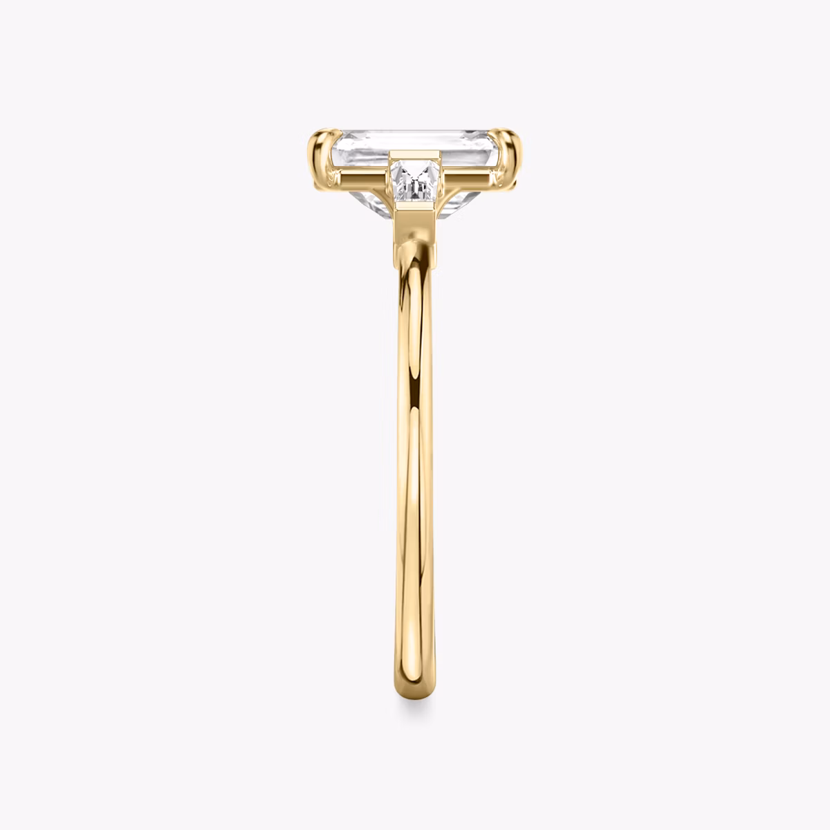 The Three Stone | Emerald | 18k | Yellow Gold | bandAccent: Plain | sideStoneCarat: 0.10ct | sideStoneShape: Tapered Baguette | diamondOrientation: vertical | caratWeight: other
