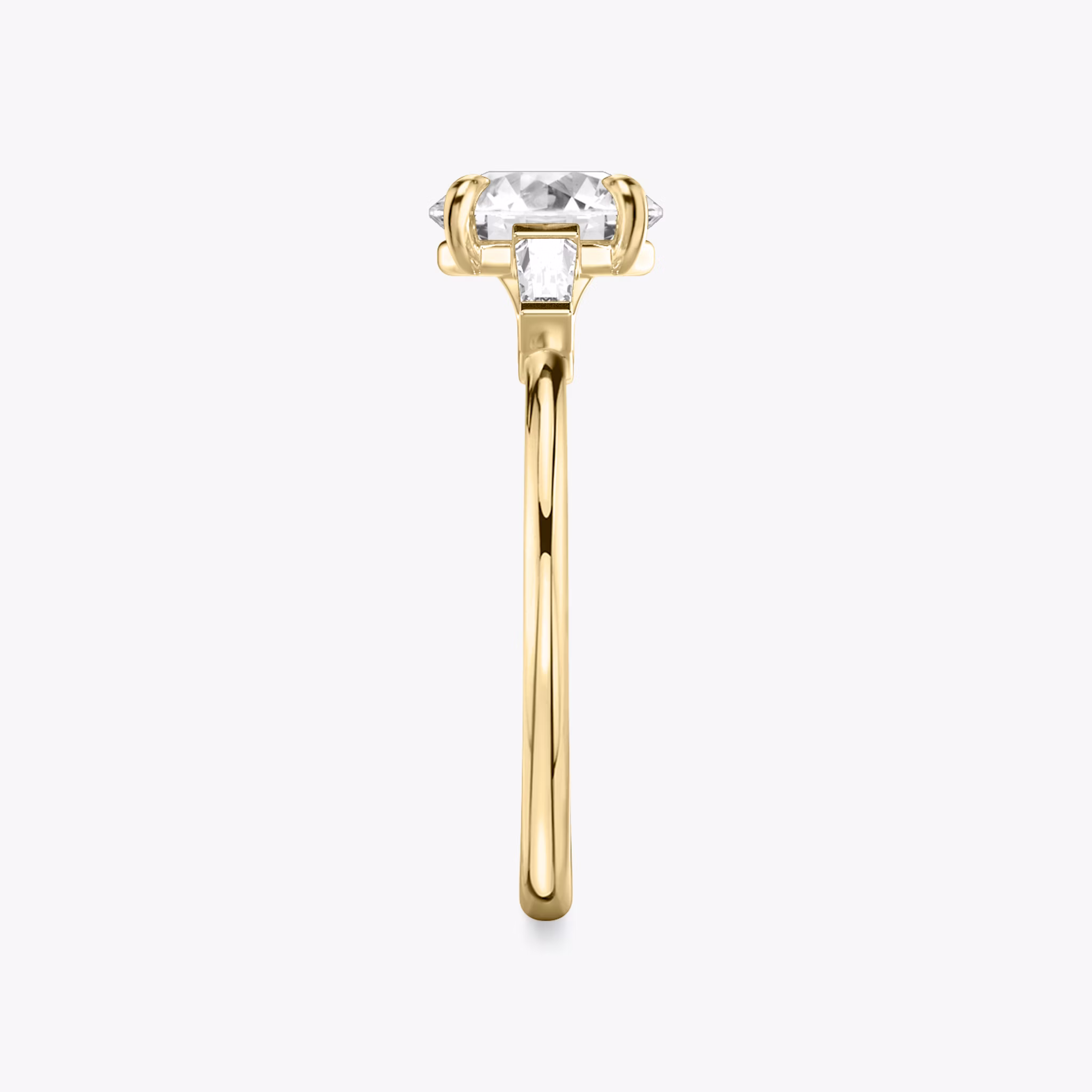 The Three Stone | Round Brilliant | 18k | Yellow Gold | bandAccent: Plain | caratWeight: other | sideStoneCarat: 0.10ct | sideStoneShape: Tapered Baguette | diamondOrientation: vertical