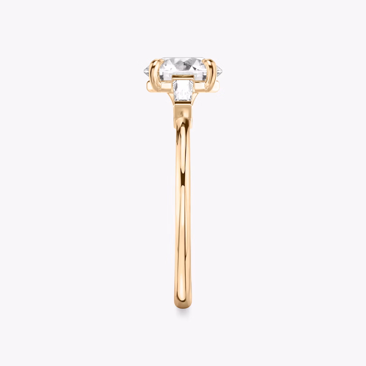 The Three Stone | Round Brilliant | 14k | Rose Gold | bandAccent: Plain | caratWeight: other | sideStoneCarat: 0.10ct | sideStoneShape: Tapered Baguette | diamondOrientation: vertical