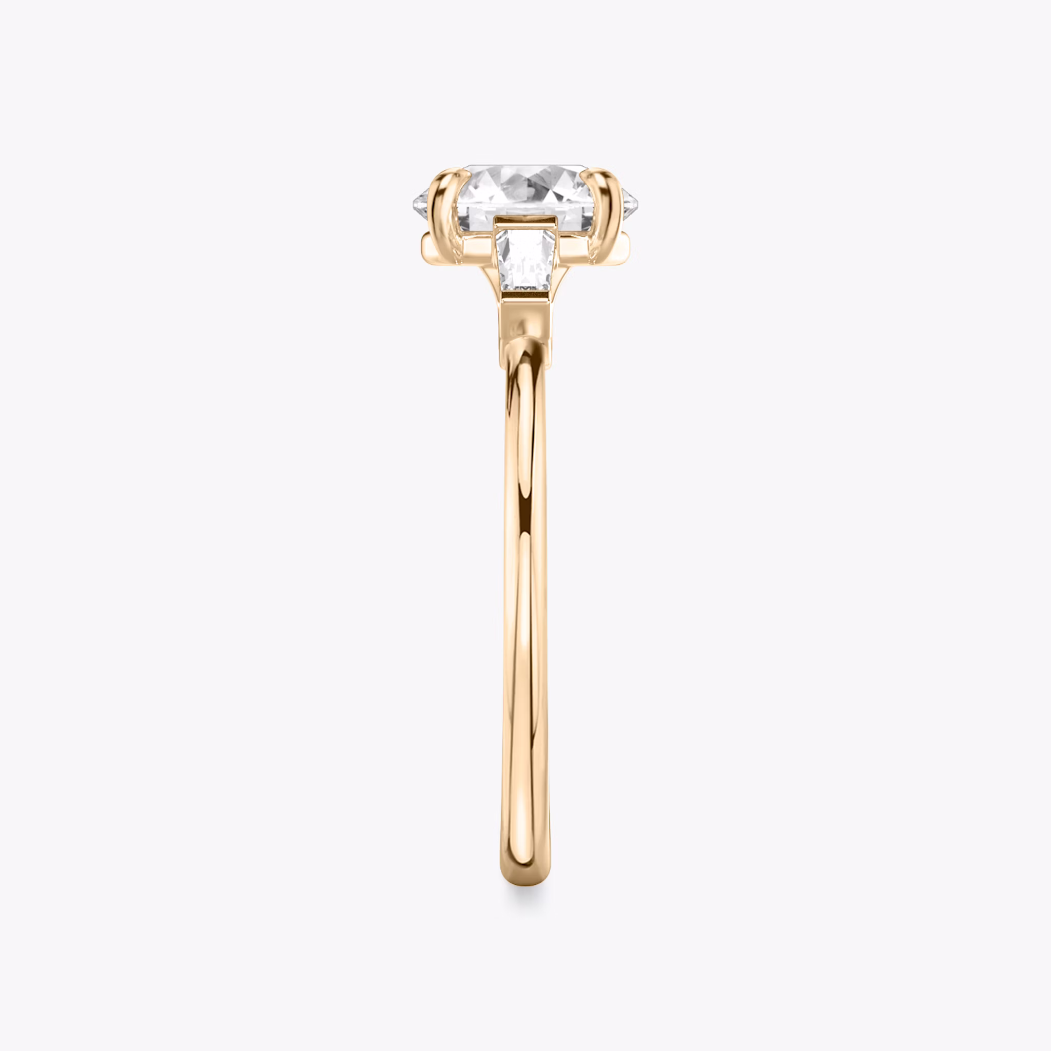The Three Stone | Round Brilliant | 14k | Rose Gold | bandAccent: Plain | caratWeight: other | sideStoneCarat: 0.10ct | sideStoneShape: Tapered Baguette | diamondOrientation: vertical