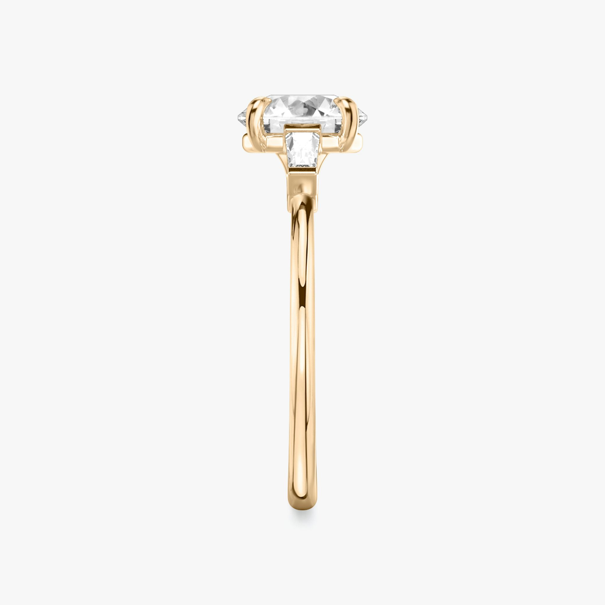 The Three Stone | Round Brilliant | 14k | Rose Gold | bandAccent: Plain | caratWeight: other | sideStoneCarat: 0.10ct | sideStoneShape: Tapered Baguette | diamondOrientation: vertical