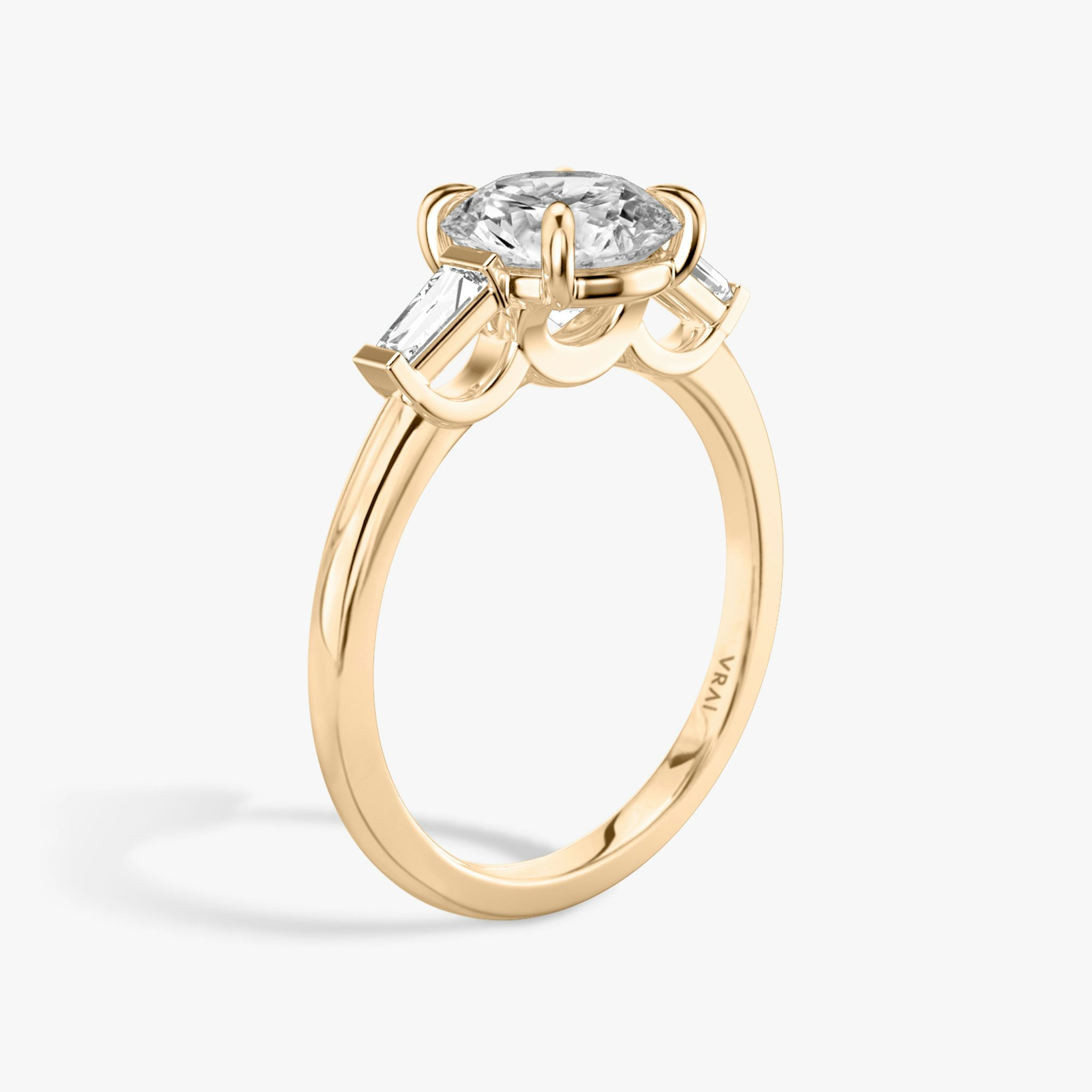 The Three Stone | Round Brilliant | 14k | Rose Gold | bandAccent: Plain | caratWeight: other | sideStoneCarat: 0.10ct | sideStoneShape: Tapered Baguette | diamondOrientation: vertical