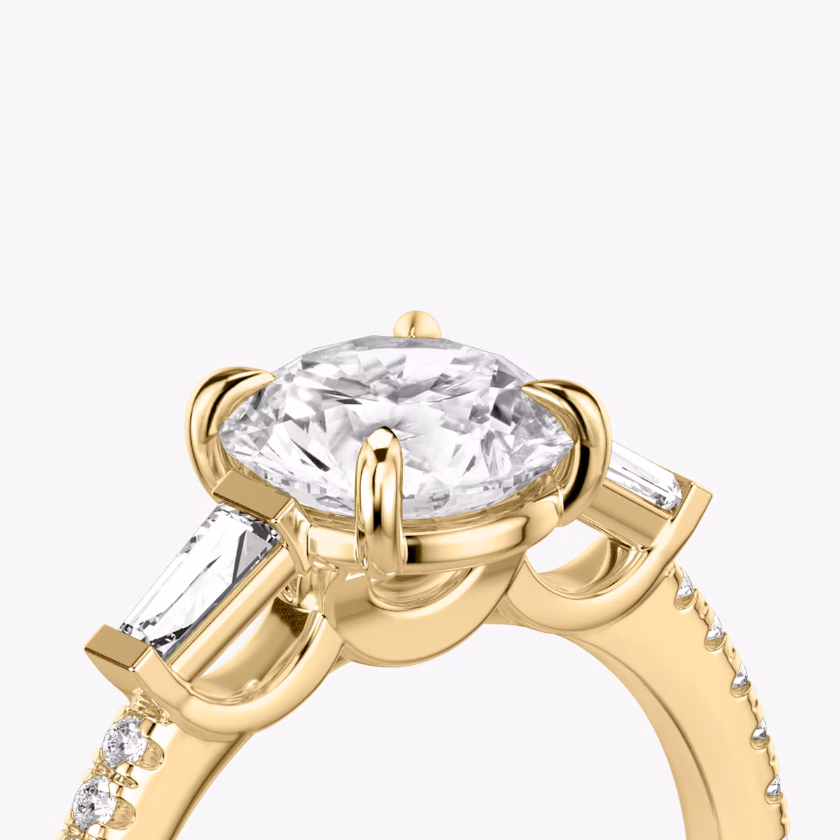 The Three Stone | Round Brilliant | 18k | Yellow Gold | bandAccent: Pavé | caratWeight: other | sideStoneCarat: 0.10ct | sideStoneShape: Tapered Baguette | diamondOrientation: vertical