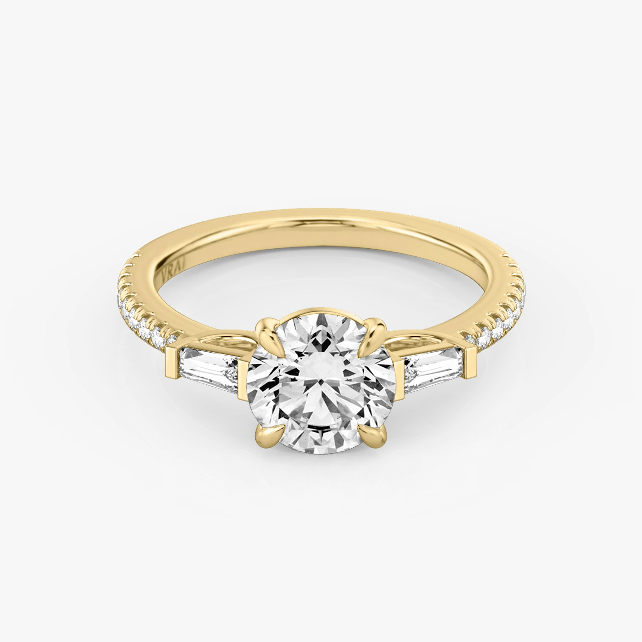 The Three Stone | Round Brilliant | 18k | Yellow Gold | bandAccent: Pavé | caratWeight: other | sideStoneCarat: 0.10ct | sideStoneShape: Tapered Baguette | diamondOrientation: vertical