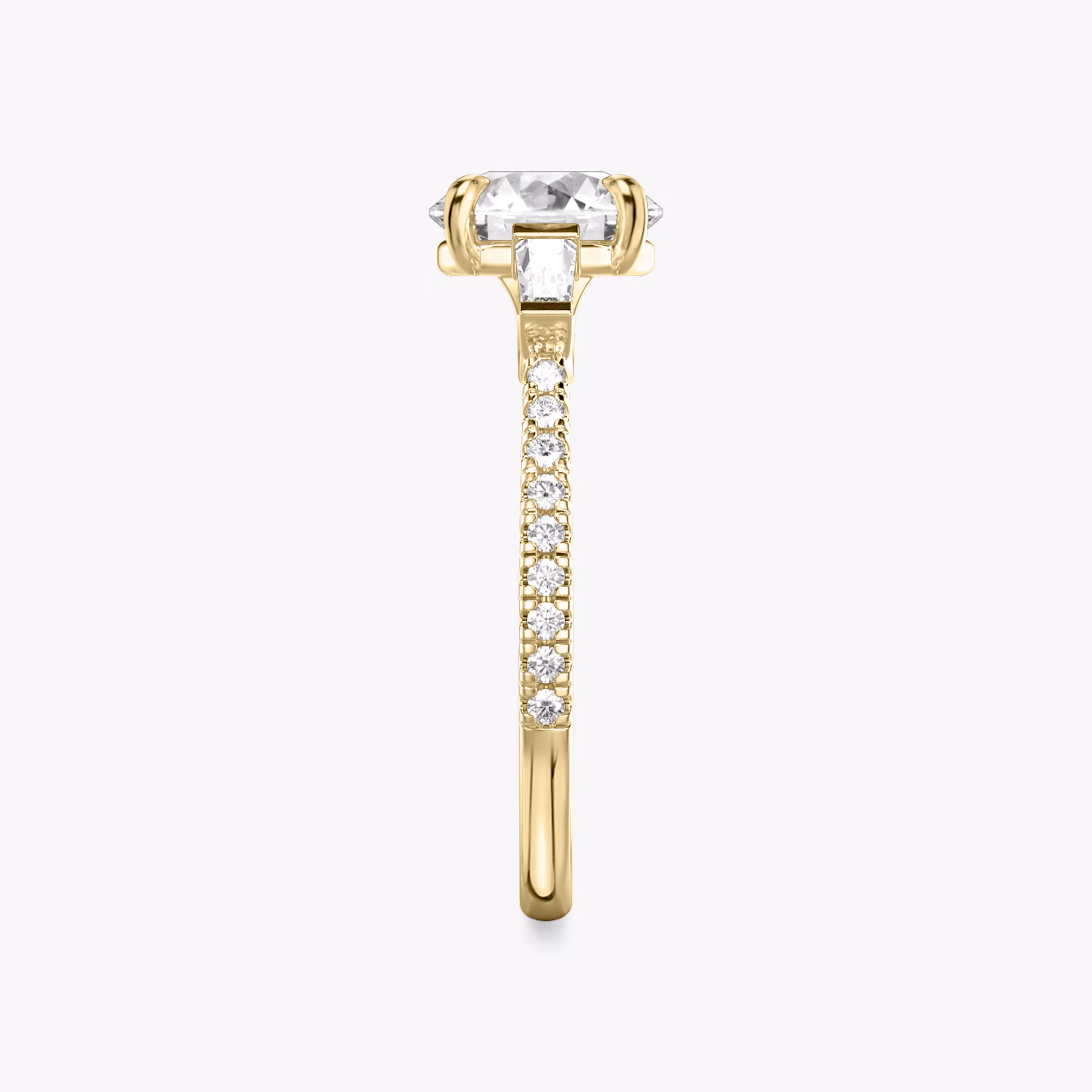 The Three Stone | Round Brilliant | 18k | Yellow Gold | bandAccent: Pavé | caratWeight: other | sideStoneCarat: 0.10ct | sideStoneShape: Tapered Baguette | diamondOrientation: vertical